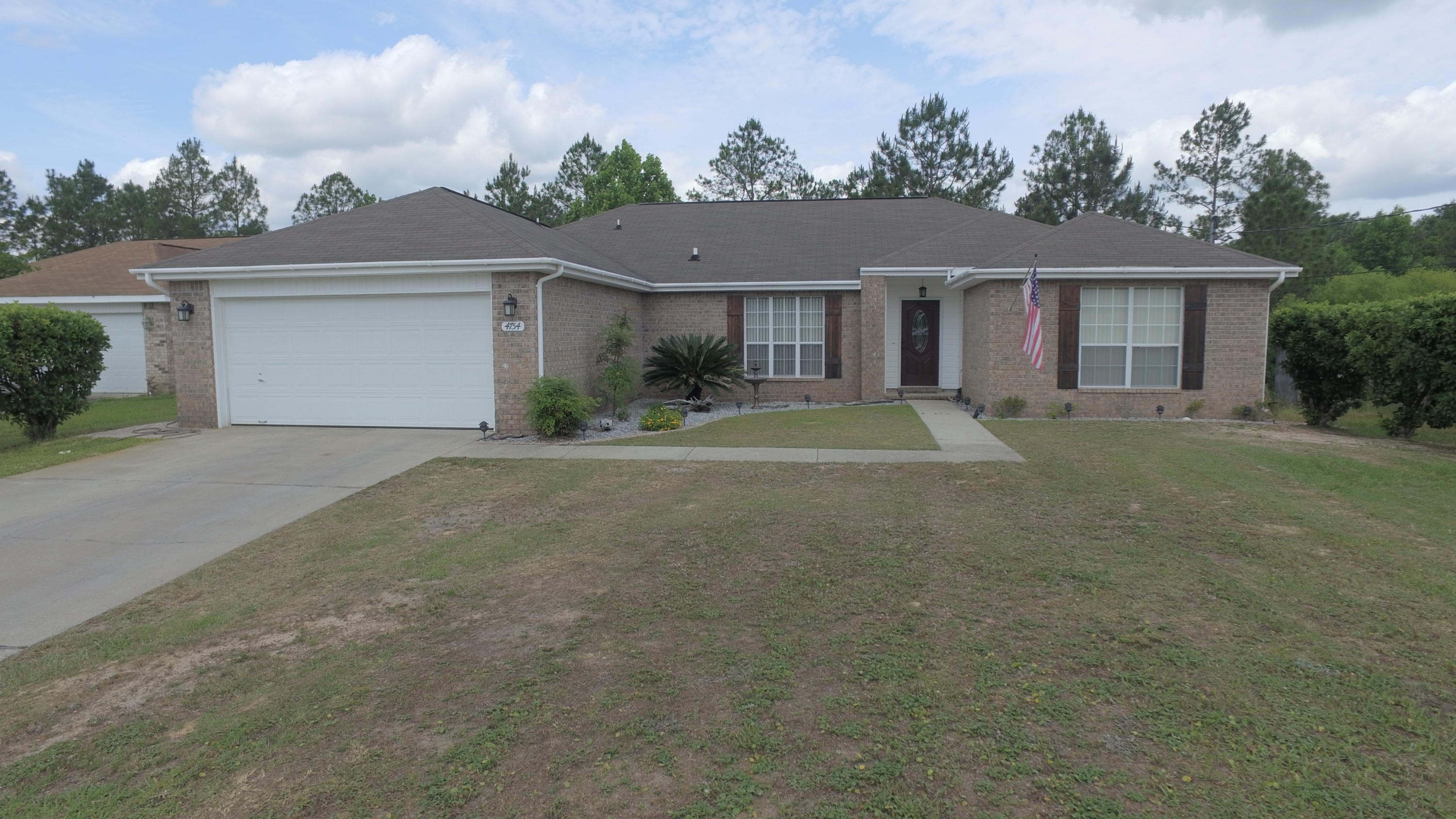 Well maintained does not begin to describe care this home has received by the owners. This South of I-10 4 bedroom/ 2 bath home sits on a culdesac with a deep .74 acre lot for plenty of privacy. The inviting entryway leads to an open concept large dining room and family room with a fireplace as the focal point. The kitchen features stainless steel appliances and plenty of counter and cabinet space. The main living area flooring is beautiful laminate and tile. The Owners suite is large enough to fit any large furniture and the Owners suite has dual closets, dual vanities, and a separate enclosed shower and garden tub. The additional bedrooms in the split bedroom floor plan are all large in size with ample closet space in each. Just off the living room features a covered deck with