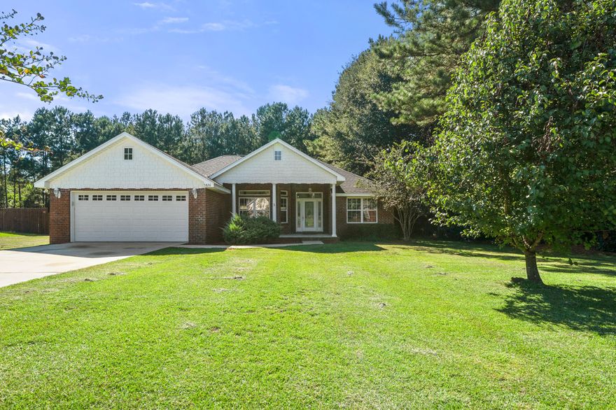 Quiet country living conveniently located to town! LARGE 1.54 acre lot with beautiful all brick home with hardie shake. The home features tile and laminate wood flooring throughout the entire house (no carpet)! 3D shingle roof, gas fireplace, as hot water heater, pex plumbing, large covered front porch ready for rocking chairs, and HUGE covered back porch ready for entertaining. Custom touches throughout this non-cookie cutter home. This home is a MUST SEE OPPORTUNITY!