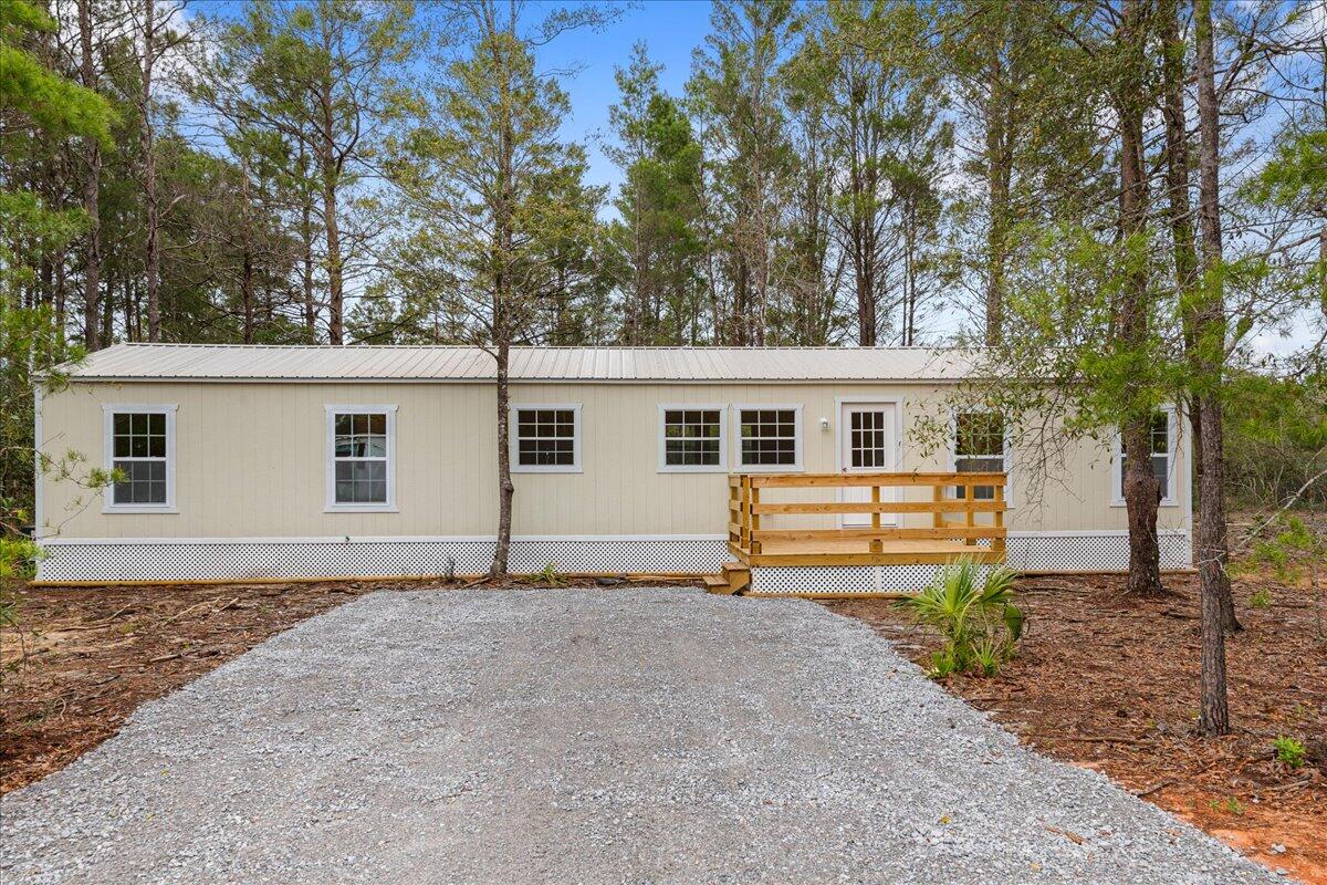 BRAND NEW stick built house priced like a mobile. This three bedroom two bath home is located on two lots equaling almost half an acre. The vaulted ceilings provide a feeling of spaciousness with plenty of natural light. The master suite provides its own bathroom and walk in closet. Offering a rural feel, but is still close to shopping, It's only 45 minutes to the beach! Buyer to verify all pertinent information.