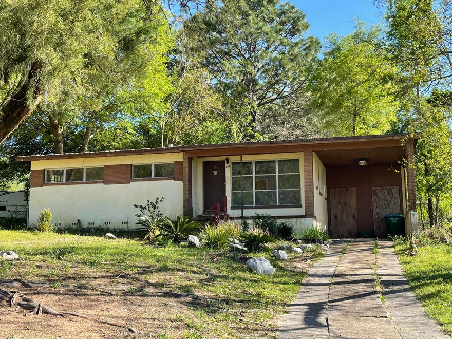 FIXER UPPER! 3 Bedroom 1 Bath in the heart of Crestview. Large corner lot with fenced back yard. 1 car carport and plenty of driveway parking. Property is being sold AS-IS.