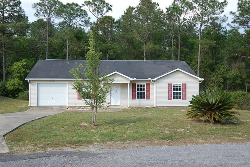 3 Bed/2 Bath with over 1,150 sq. ft. of living space, spacious kitchen lots of white cabinets and dark counters, nice sized living room, and an attached garage. The lot is close to half an acre. Quick access to restaurants and I-10. This property is bank owned. It is sold in as-is condition without repairs or warranty. Buyer is responsible for verifying all information contained in this listing.