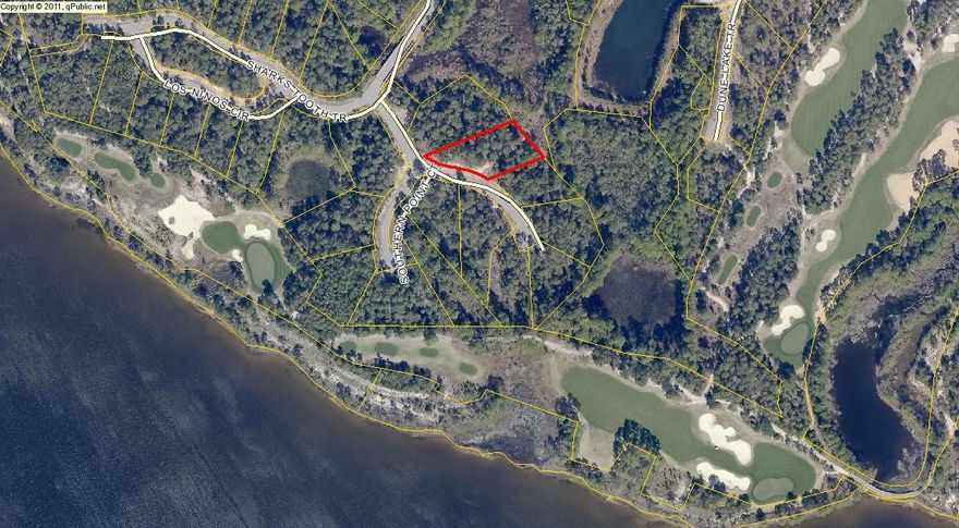 Beautiful Oak covered lot in Wild Heron. This B lot has some of the prettiest mature oaks in the community and is a short golf cart ride to the Shark's Tooth Clubhouse. Wild Heron is a 734 acre subdivision with the Award Winning Shark's Tooth Golf Course designed by Greg Norman, tennis courts, Prospect Point Pool and hot tub overlooking Lake Powell, a Community Dock and Boat House with canoes and kayaks, fitness center, outdoor pavilion, fire ring and play ground. Only the golf course and tennis courts require separate membership. Wild Heron is just a short drive to the white sandy beach of the Emerald Coast and the Gulf of Mexico. Plenty of shopping, dining, entertainment and the Panama City Beach Airport are just minutes away.