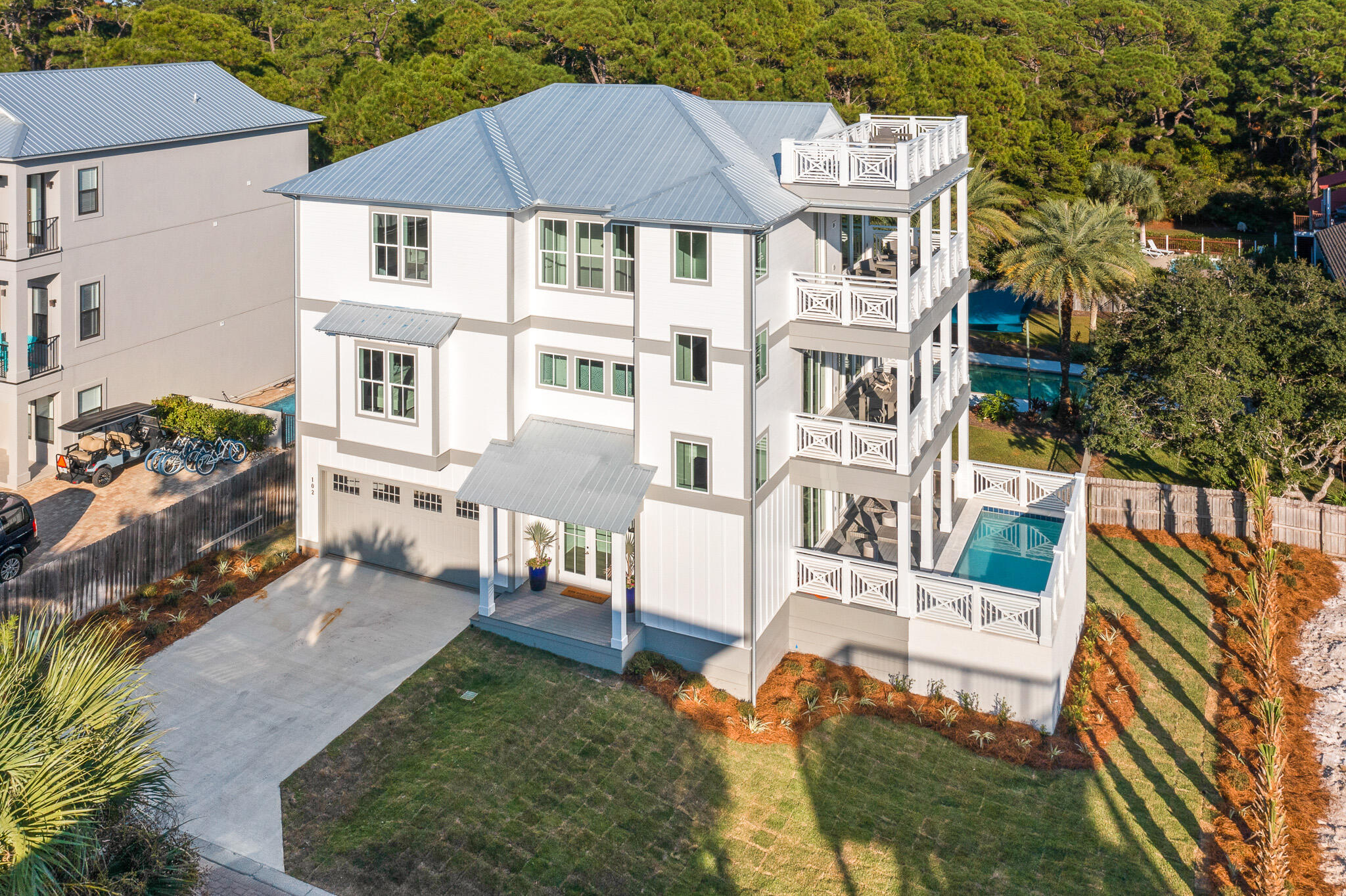 Welcome to 102 Woodward Drive- a BRAND NEW and luxurious beach home located on the beautiful West end of 30A. This dream home is uniquely positioned to capture unparalleled GULF VIEWS as well as views of Coastal Dune Lake. 5 BR/ 4.5 BA complete with multiple living areas, an elevator for quick access to each of the spacious 3 stories, a private study, and expansive balconies. The large open spaces and luxury finishes give the home a spacious and appealing vibe perfect for entertaining or a relaxing escape. Outside you will find a resort style exterior with a beautiful private pool and tropical landscaping. None of the details have been spared in the design of this home- everything from the lighting to the fixtures are of the highest quality and flows aesthetically throughout.