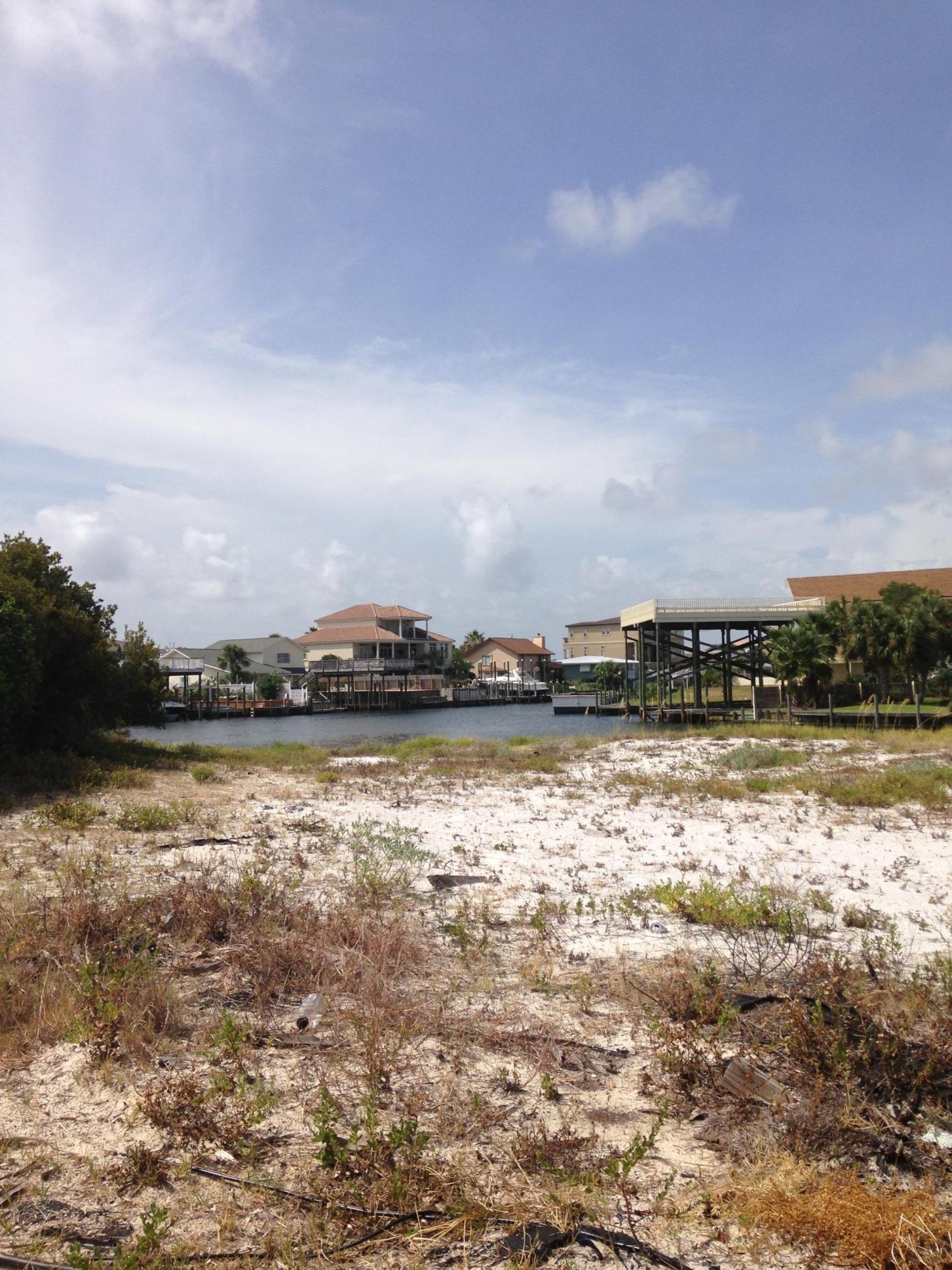 BUILD YOUR DREAM HOUSE ON THIS LARGE WATERFRONT LOT HAS 90 WATERFRONT FT. AND JUST 2 BLOCKS FROM THE BEACH AND SO CLOSE TO THE OPEN HARBOR AND THE INTRACOASTAL. THE BACK OF THE LOT IS SOUTH FACING FOR WARM SUNSHINE ALL YEAR LONG! IF YOU HAVE BEEN WAITING FOR THE DEAL OF THE YEAR THEN HERE IT IS! SEAWALL IN PLACE AND READY FOR YOUR PLANS...GREAT STREET AND HOMES ARE SELLING IN THE MILLIONS. CALL FOR MORE INFORMATION!