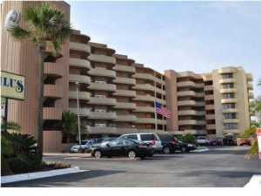 Remarks: You don't want to miss the opportunity to own this well located end unit with wrap around balcony and amazing views. Excellent views from both the living area and master bedroom. The living area and master bedroom are directly facing the water views and have easy access to the balcony area through new sliding glass doors. The spacious kitchen has lots of cabinets,counter space and large breakfast bar. Upgrades include refacing the cabinets including adding new doors and drawer fronts, and solid surface countertops, smooth top stove, microwave and refrigerator in 2007. Balcony furniture and flat screen TV's in 2009. Updated stack washer & dryer, update hot water heater and 16 seer air conditioner in 2010. Covered parking available under the building