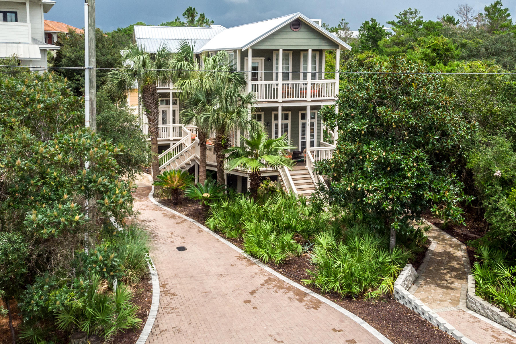 THIS HOME IS A RENTAL MACHINE! What a unique find in the heart of Seagrove plus a privacy buffer on the east side of lot. Close to shopping and dining and only a short walk to the Eastern Lake beach access, where you will enjoy the sugar white sand and emerald green waters of the Gulf of Mexico ! Main home has 4 spacious bedrooms, with one on first floor, and an abundance of charming porches for great relaxation. Guest house offers 3 Bedrooms giving owners or renters the opportunity to have their whole family on vacation but maintaining a sense of privacy. Gorgeous pool and hot tub lies between the main house and the guest house (with it's own driveway) for lots of family fun .