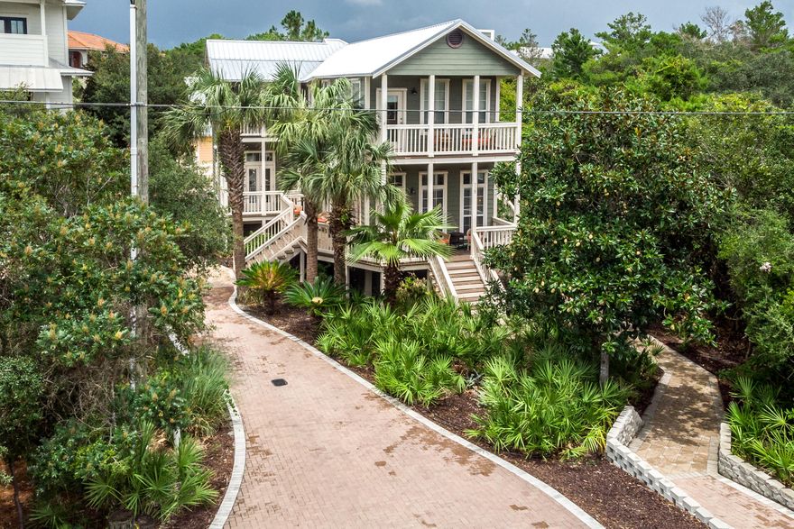 THIS HOME IS A RENTAL MACHINE! What a unique find  in the heart of Seagrove plus a privacy buffer  on the east side of lot.  Close to shopping and dining and only a short walk to the  Eastern Lake beach access, where you will enjoy the sugar white sand and emerald green waters of the Gulf of Mexico ! Main home has 4 spacious bedrooms, with one on first floor, and  an abundance of charming porches for great relaxation. Guest house offers 3 Bedrooms giving owners or renters  the opportunity to have their whole family on vacation but maintaining a sense of privacy.   Gorgeous pool and hot tub lies between the main house and the guest house (with it's own driveway)  for lots of family fun .