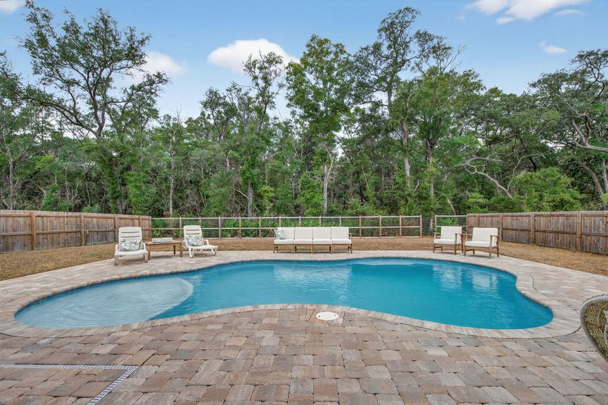 Better than new and move-in ready, with upgrades already done for you. This home stands out with a heated saltwater gunite pool (2023) surrounded by beautiful pavers, giving you a private backyard retreat from day one.The backyard is designed for both privacy and openness, with full fencing and peaceful tree-line views at the rear of the property.Inside, the home feels bright and modern with 9' ceilings on the main level, LVP flooring, and ivory shaker cabinetry paired with quartz countertops throughout.The primary suite offers a spa-like feel with a tiled walk-in shower, soaking tub, and large walk-in closet. Enjoy lower HOA costs while being just minutes from Hammock Bay, perfect for bike rides, walks, and evenings at Props Brewery. Conveniently located near Niceville, Destin, and the white sand beaches of 30A, this home offers privacy, upgrades, and location. All without the wait of new construction.

Modern. Private. Turn-key.