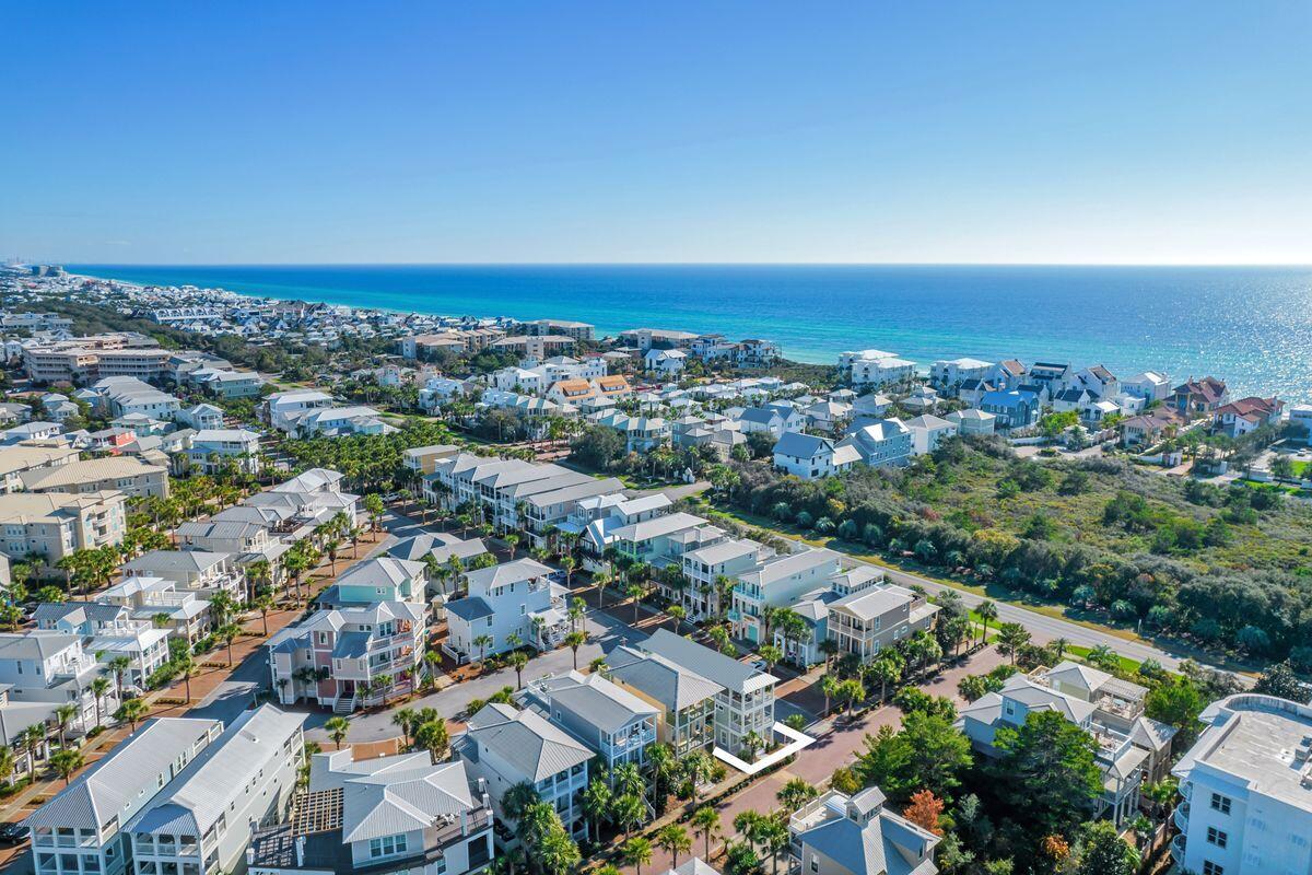 Under contract with 24-hour kickout clause. Home is complete!  New construction with gulf views one row off of Scenic Highway 30A are hallmarks of this Seacrest Beach retreat that features a gourmet kitchen and more than 1,300 square feet of porches just a short stroll to the 12,000-sq.-ft., community pool. This four-bed, four-bath home boasts more than 2,800 square feet of living space on three floors and deeded beach access. Designed to be used as a vacation rental or primary/secondary home, the open-concept floor plan provides room for entertaining and family gatherings. The gourmet kitchen will host one of two beverage coolers and ice machines, with additional appliances in the third-floor wet bar.