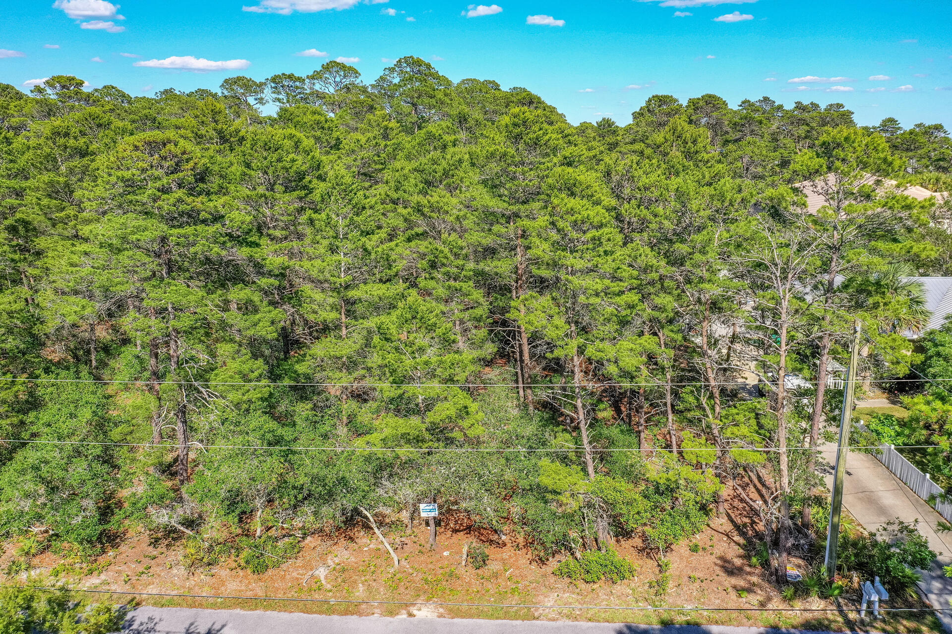 Oversized lot located in a fantastic location. Hidden away from thoroughfare traffic but convenient to move everything. This lot is located within walking distance to Ed Walline beach access and close to shopping and restaurants. No HOA or build out time.