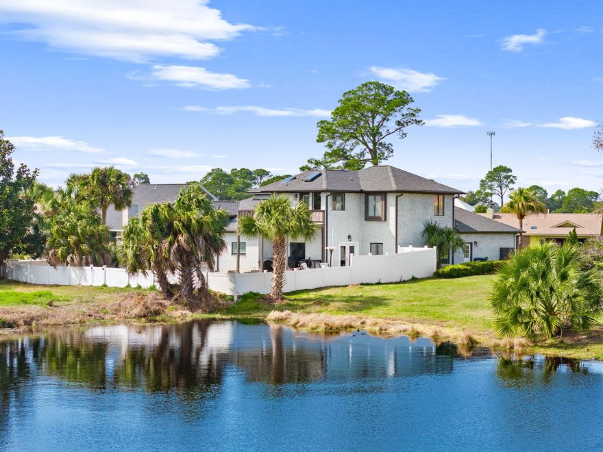 Located within the gated golf and marina community of Bay Point, this fully remodeled 4-bedroom, 3-bath residence offers 2,913 square feet designed for elevated coastal living and exceptional entertaining. Renovated top-to-bottom in 2019--including roof, electrical, lighting, appliances, two water heaters, and dual HVAC systems--the home blends modern infrastructure with curated coastal style. Brand-new custom closet systems throughout, upgraded kitchen cabinetry with convenient pull-out storage, added recessed lighting with strategically placed dimmers, and thoughtful design details reflect meticulous care. The kitchen also features a brand-new ice maker that conveys, along with a premium faucet offering a built-in seltzer dispenser, available with an acceptable offer. The flexible layout includes a private first-floor primary suite and an expansive upstairs retreat with a spa-inspired bath and private balcony, creating a true owner's sanctuary. A mezzanine bonus level (now a massage room) offers ideal space for an office, lounge, or flex area. Designed to host, the former dining room has been transformed into a striking Bourbon Lounge and Sports Theater, complete with custom shelving, LED accent lighting, kegerator, beverage refrigeration, and double doors opening to a newly completed 1,140 sq ft bi-level paver patio. The patio is thoughtfully prepped for a future outdoor kitchen with reinforced stone underlayment and utility conduits beneath the pavers--built for game days, gatherings, and coastal evenings alike. Additional highlights include brand-new vinyl fencing with multiple gated access points (including an oversized entry), custom garage storage, irrigation, and motion lighting. Select features--including bourbon lounge equipment, gym equipment, beverage appliances, and additional refrigerators--may convey with an acceptable offer. Bay Point offers gated security, championship golf, marina access, and one of Panama City Beach's most established residential environments. Opportunities with this level of renovation and entertaining infrastructure in Bay Point are increasingly rare.