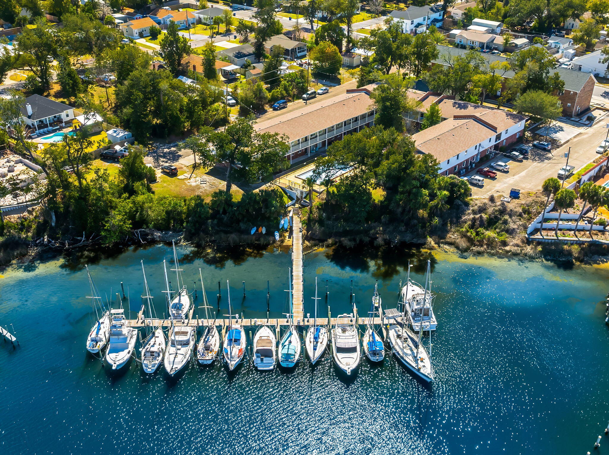 Discover an exceptional investment opportunity with this renovated, multifamily apartment community situated on a prime waterfront location. Boasting 34 units, this property seamlessly integrates residential living with marina access, featuring a 22-slip marina ideal for water enthusiasts. The community offers a diverse mix of unit configurations, including 12 one-bedroom units, each 650 sq. ft., and 22 two-bedroom units, each 920 sq. ft., designed for comfortable, modern living. Recent renovations in 2020 have transformed 22 of these units down to the ''studs,'' bringing them up to contemporary standards with high-quality finishes. New roofs and mechanicals provide peace of mind, while stainless appliances and composite floors enhance the style and functionality of each living space. Every unit features new interior sheet rock, insulation, siding, windows, and doors, all compliant with the 2019 Miami / Dade FL Building Code. Currently 100% occupied, the property is a beacon of stability and profit potential. With $4.4 million in fixed-rate 3.75% assumable, non-recourse financing available, this is a rare chance to get a prime asset in a sought-after location with immediate cash flow. Don't miss the opportunity to own this unique, garden-style apartment community that combines luxury living with waterfront charm.
