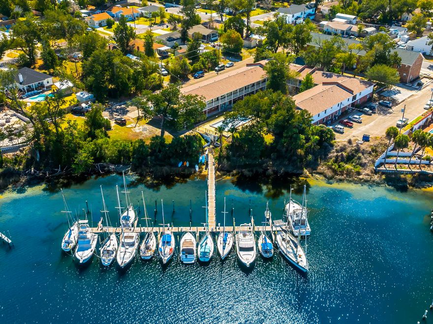 Discover an exceptional investment opportunity with this renovated, multifamily apartment community situated on a prime waterfront location. Boasting 34 units, this property seamlessly integrates residential living with marina access, featuring a 22-slip marina ideal for water enthusiasts. The community offers a diverse mix of unit configurations, including 12 one-bedroom units, each 650 sq. ft., and 22 two-bedroom units, each 920 sq. ft., designed for comfortable, modern living. Recent renovations in 2020 have transformed 22 of these units down to the ''studs,'' bringing them up to contemporary standards with high-quality finishes. New roofs and mechanicals provide peace of mind, while stainless appliances and composite floors enhance the style and functionality of each living space. Every unit features new interior sheet rock, insulation, siding, windows, and doors, all compliant with the 2019 Miami / Dade FL Building Code. Currently 100% occupied, the property is a beacon of stability and profit potential. With $4.4 million in fixed-rate 3.75% assumable, non-recourse financing available, this is a rare chance to get a prime asset in a sought-after location with immediate cash flow. Don't miss the opportunity to own this unique, garden-style apartment community that combines luxury living with waterfront charm.