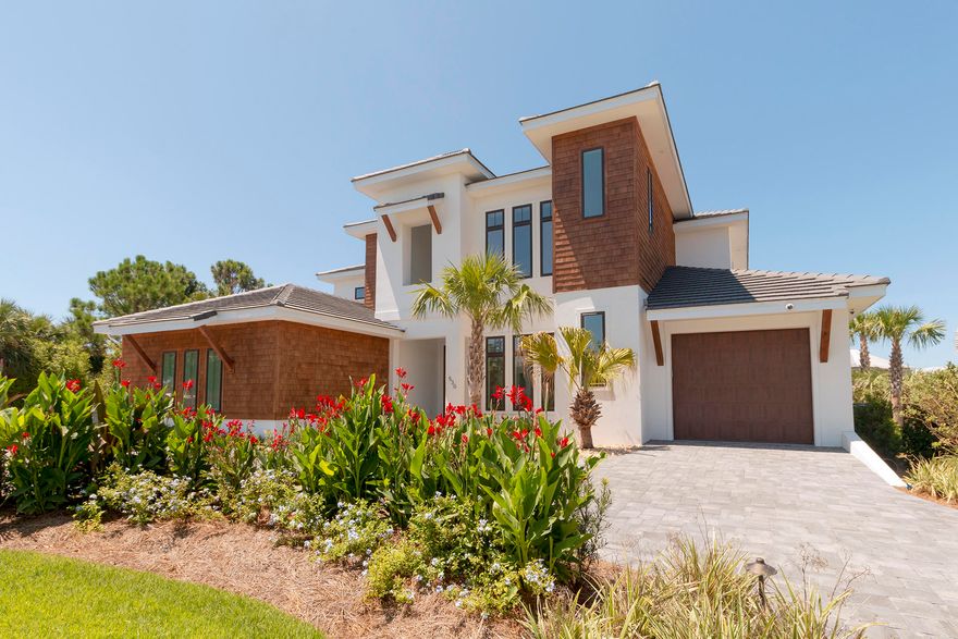 Unbelievably gorgeous 5BR/5.5BA, 5,087SF Canal Front home with one of the larges slips on Holiday Isle. This home spares no expense, from the 9'' plank hardwood floors to state-of-the-art smart home system with Lutron electric shades in all bedrooms, dining & front door, Visualint security digital camera system with DVR, lighting, pool automation & LED lighting. Entering the home, you are greeted by soaring ceiling and amazing views.  The living room features a 2-story fireplace and 85'' Sony TV. The kitchen is a chef dream with Wolf/Sub Zero Appliances, quartz countertops and hidden pantry. Outside is a large outdoor living space with summer kitchen, large pool, boat slip with lift, jet ski lift, & plenty of room to entertain.