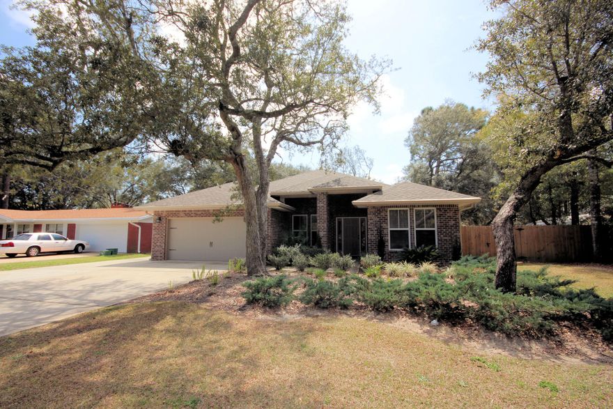 Seller says she hates to leave, loves home and especially the flexibility of the floorplan. Home was built by a multiple award-winning builder and consecutive parade of homes winner. This handsomely appointment 2124 sq. ft. property features brick and vinyl exterior accents and superior landscaping. Home is within minutes from Eglin AFB, Hurlburt AFB and and emerald green waters, sugar white beaches and shopping. Design amenities in this classic build home are exquisite and provide the essence of gracious living. The front porch says welcome as you approach the driveway. Entering the foyer, you are welcomed by a light and bright floorplan highlighted with 10 foot ceilings, hand scraped hardwood flooring and 5 1/4 baseboards through out the main living areas.