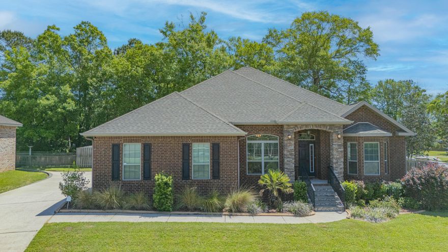 This beautifully crafted brick residence includes 4 spacious bedrooms and 3 full bathrooms. The kitchen has a large island, a convenient hop-up bar, counter and cabinet space galore, as well as, a cozy breakfast nook. The bonus room is located off the living room and includes a gas fireplace, perfect for a relaxing retreat. Step out back and fall in love with the outdoor kitchen, featuring a gas grill, sink, and prep area, all under a covered patio with two ceiling fans and a gas fireplace. The home also includes recessed lighting around the entire perimeter in the eaves, adding a warm ambiance to your outdoor gatherings. Additional features include a whole-house generator for peace of mind, a privacy fence for added seclusion, and elegant stone columns.