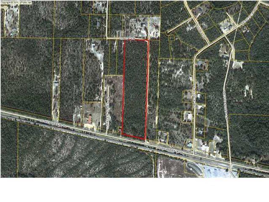 19 wooded acres. 450 feet on Hwy 90. Excellent visibility & high traffic. 1930 feet on Linda Lane. Zoned Rural Village.