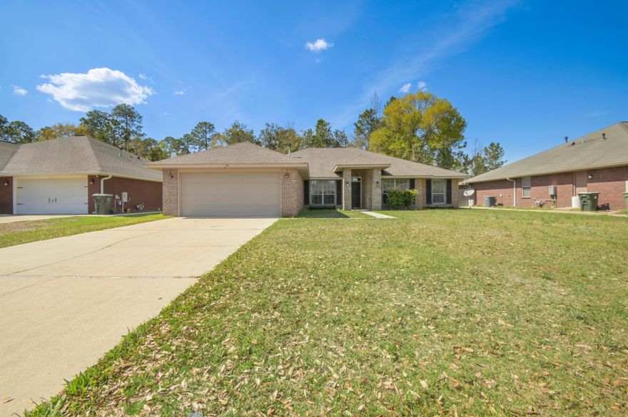 2.75% ASSUMABLE VA LOAN! This HUGE home comes with 4 beds PLUS AN OFFICE and is located in a charming neighborhood only 20 minutes from downtown Pensacola! Walking inside you will immediately notice the massive size of the house, with the vaulted ceiling in the central living space amplifying the size even more! To the right of the entrance you are greeted by a room that can be used as an office, and to the left the formal dining room. Heading forward into the living area, there is plenty of room for entertaining guests and a fireplace to cozy up to during our cold NW Florida winters. Designed for the family chef, the kitchen is equipped with seemingly unlimited counter space, tons of cabinetry, a pantry, and even a secondary dining area overlooking the backyard. The bedrooms are split on either side of the house, providing privacy for the massive master bedroom. The master can easily accomodate a California king bed with room to spare for all your additional furniture. Heading into the master bathroom is like walking into your own private spa. The en-suite is equipped with 2 walk-in closets, a private water closet, double vanity, a jetted soaking tub, and a separate shower. Each additional bedroom fits a queen bed, and share a bathroom in the hallway. This home includes a spacious laundry room with convenient cabinetry. Step out onto the patio with a cup of coffee and enjoy your fully fenced backyard which backs up onto a natural area - never to be developed. Stop by and make this house your future home! 2023 HVAC & new roof will be installed prior to closing!