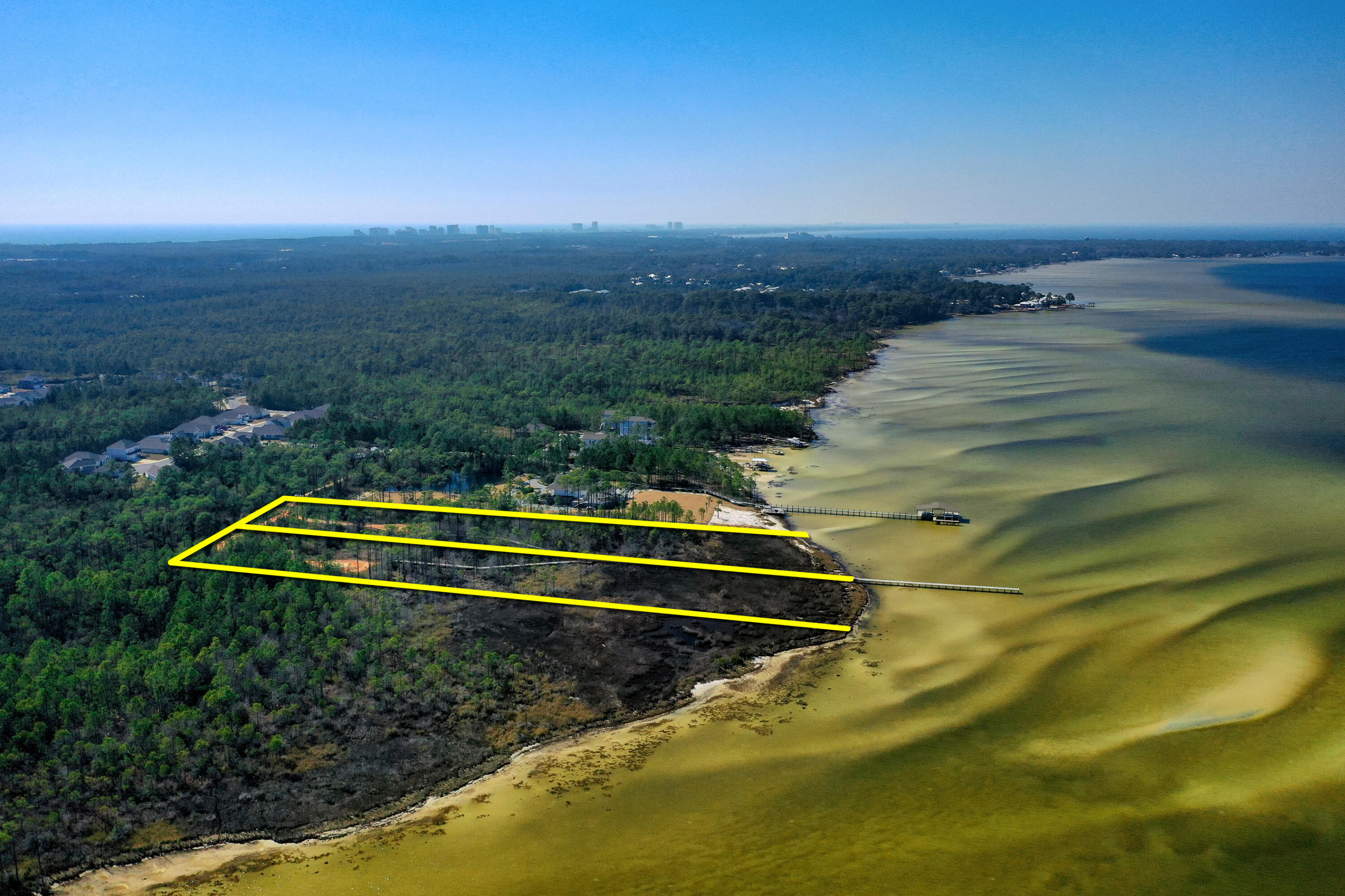 DRASTIC LIST PRICE REDUCTION! NO HOA! A unique opportunity to acquire waterfront acreage (approximately 2.5-acres & 164' of frontage) on the Choctawhatchee Bay surrounded by tranquil greenspace, thus privacy that is uncommonly offered in an area that is in favorable proximity to Santa Rosa Beach, Florida's premier shopping, restaurants, and the primary hospital. The list price is contingent upon the simultaneous closing of the adjacent waterfront acreage, MLS 893391. Together, the two building sites and existing pier, measuring 200' in length, would assemble an amazing family bayfront compound (totaling over 5-acres) at an undeniable value! This magnificent acreage is adjacent to a State of Florida preserved forest. Please inquire for further details.