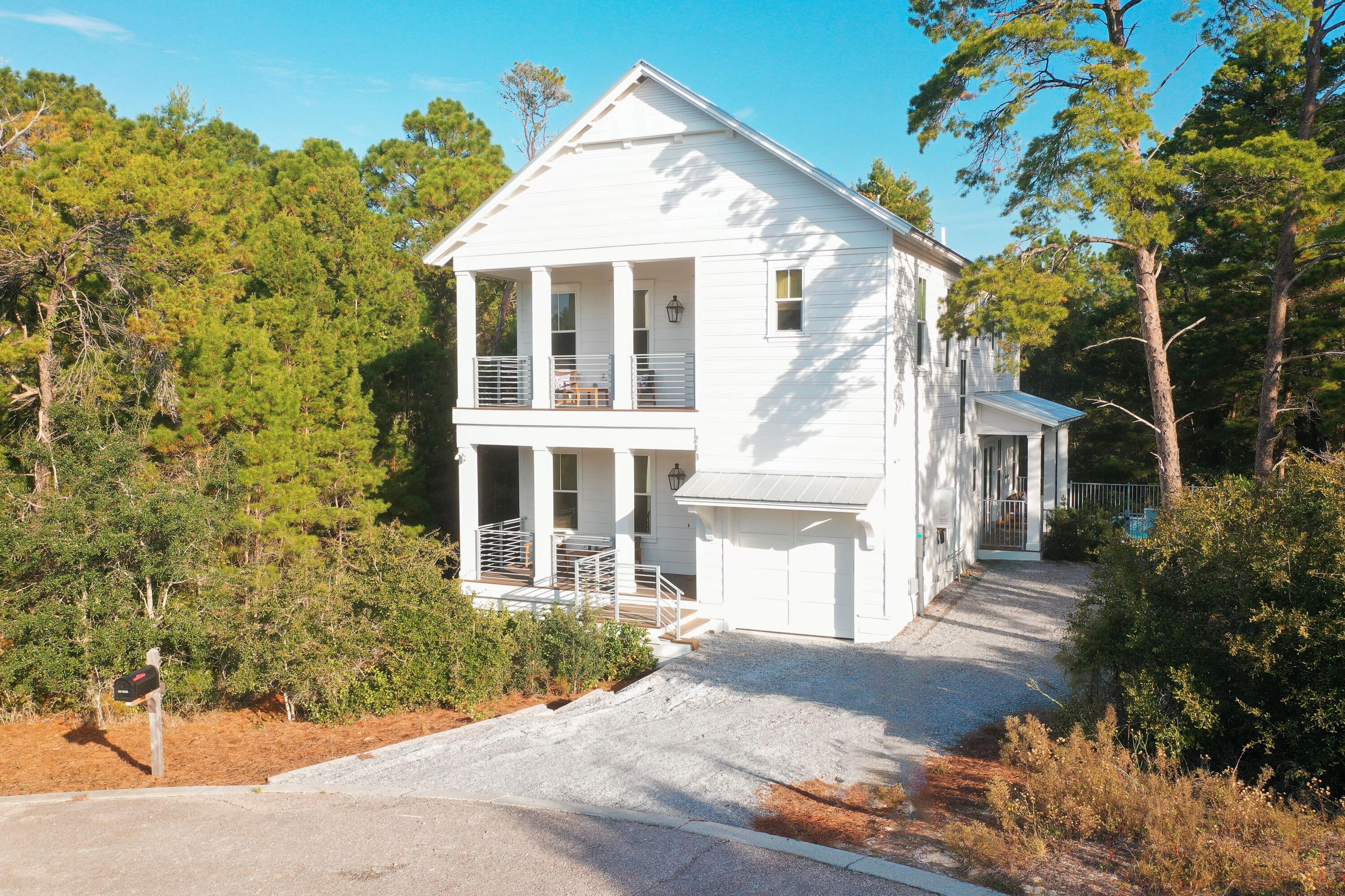 If you're looking for the ULTIMATE five star luxe vacation rental to add to your investment portfolio or as an incredible multi-generational second home, welcome to your new 30A beach beach retreat -- 213 Spotted Dolphin Road. Newly built in 2022 with impeccable upgrades, this custom two-story home is located in Hidden Highlands, a private non-HOA community on the popular west end of 30A. Tucked away on a quiet street, at the end of a cul-de-sac nestled under mature trees, this coastal gem was meticulously curated and includes all the high-end finishes and amenities on your dream beach house checklist. High-quality craftsmanship, custom shiplap throughout, 10 ft ceilings, private heated pool, quiet cul-de-sac location, three expansive porches that extend your outdoor living are just a few With no HOA, more than $142K gross actuals for 2024 and over $65K already on the books for 2025, this property makes an incredibly compelling investment property, second home or primary residence. An abundance of porches extends the living space on both levels. The first floor boasts a junior master suite, expansive open-concept dining/living room with a chef's culinary delight kitchen, adorned with bronze fixtures and complete with an oversized quartz island, gas range, owner's pantry and two additional storage pantries. A powder room is conveniently located off the main living room that also has direct access to the custom heated pool with plenty of room for lounging while taking a respite from beach days. 
An abundant light-filled second floor showcases your second (primary) master ensuite complete with a private ensuite, walk-in closet flooded with natural light. A secondary loft living space is perfect for kids and guests to have private space to relax. Directly off the loft living area is a flex room currently used a double bunk bed room but makes for an office or craft room. Two additional guest suites are located at the front of the house connected by an gorgeous upper porch perfect for enjoying morning coffee or evening cocktail to capture sunsets. The private heated pool has a soothing waterfall feature surrounded by custom wrought-iron fence with surround deck for enjoying sunny afternoons under a canopy of mature trees.
With generous closets and storage, as well as a garage for your golf cart, this home presents as an excellent option for a full time, second home or short-term rental property. An easy bike or golf cart ride to three public beach accesses on 30A and close to popular hotspots Stinky's Fish Camp, Three Brothers BBQ, Shunk Gulley, Perfect Pig. The location is ideal with close proximity to schools, groceries, health care with Destin to the west and 30A to the east. , 

With a compelling NEW price, this elegant coastal oasis is turnkey and sold fully-furnished. Call today to schedule your private showing or a schedule of upcoming open houses. 

Buyer to verify all dimensions. Golf cart is leased and does not convey. 