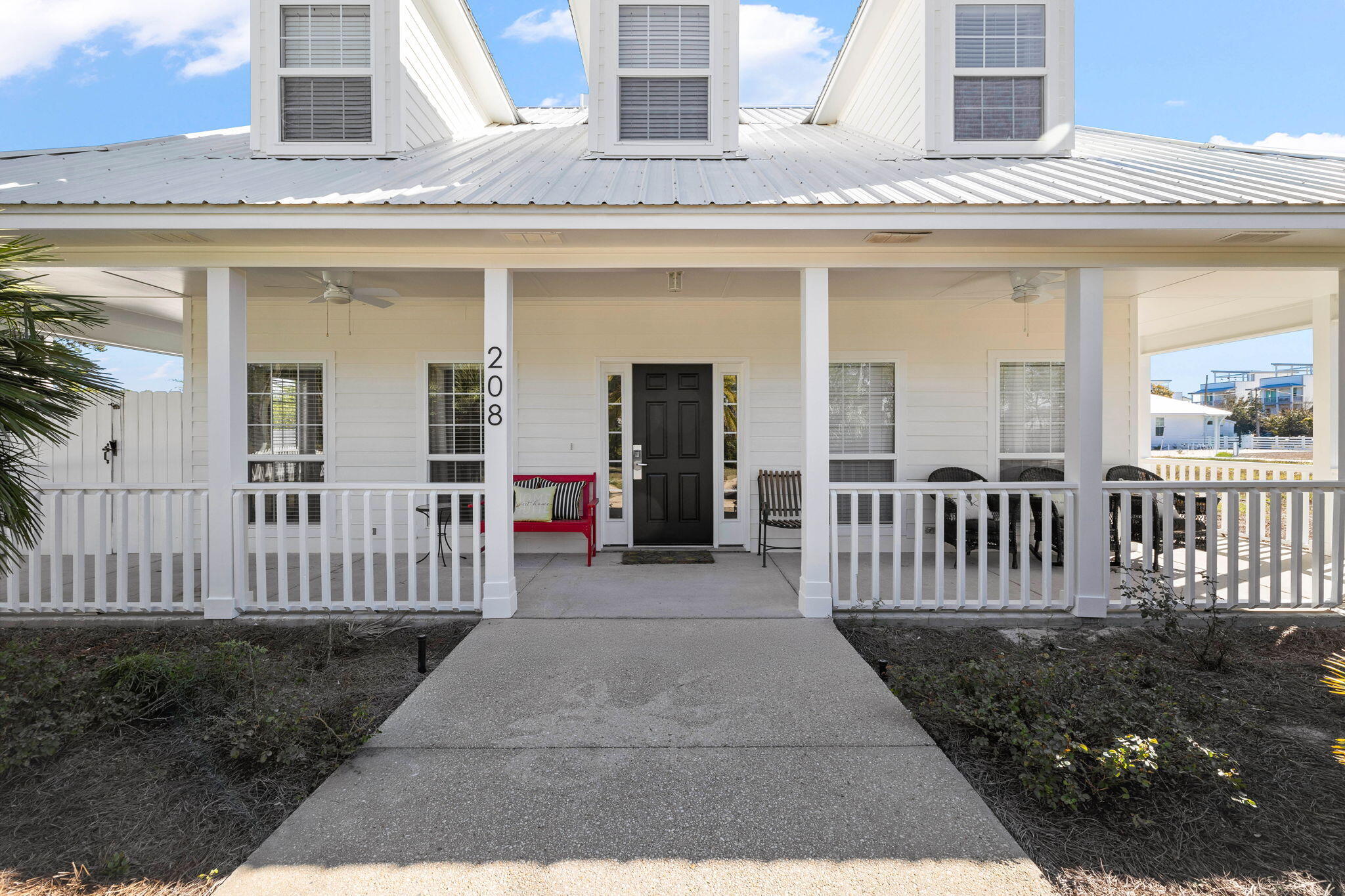 This stylish two-story beach house has been fully renovated inside and out. Sitting on a beautifully landscaped 0.36 lot, this elegant single-family home has dormer windows on the second floor and the added luxury of privacy and space. As well as the private pool, there's ample space to add a garage or carriage house, if desired. A horseshoe-shaped driveway provides ample parking and an attractive approach to the house. Screened by tropical palms, the full-width front porch offers a welcome place to relax and 'smell the roses' at the end of a busy day. Inside, the home has been fully renovated with great attention to detail. European oak floors flow throughout the home, while new drapes, paint and a pendant chandelier add a touch of sumptuous luxury to the spacious living and dining areas. The kitchen continues the flawless finish with new Shaker-style cabinets with soft-close drawers beneath quartz countertops. The well-lit breakfast nook has a built-in banquette with storage beneath the custom pad seats. All-new stainless appliances, an eye-catching Fulgor Milano range with induction cooktop and a glazed Moroccan tile backsplash complete the stylish appeal. The newly enlarged master bedroom has shiplap, new drapes and a nicely proportioned closet. The adjoining bathroom has new tile on the floor, walls and shower, complementing the oval tub, double vanity and new faucets. A newly fashioned bunk room has increased the overall accommodation and includes built-in bunks (twin/full/full trundle) with custom storage niches and individual lighting. The beautiful outdoor areas take Florida living outside to a sizeable yard screened by golden bamboo and a privacy fence. The repainted pool deck provides an inviting space for relaxing while kids play nearby. A new pool heater, new storage shed and a Wi-Fi-controlled Rain Bird sprinkler system add the final touches. This well-located home is within easy reach of sandy beaches, 30 Avenue shops and Rosemary Beach dining via the new Highway 98 pedestrian underpass.