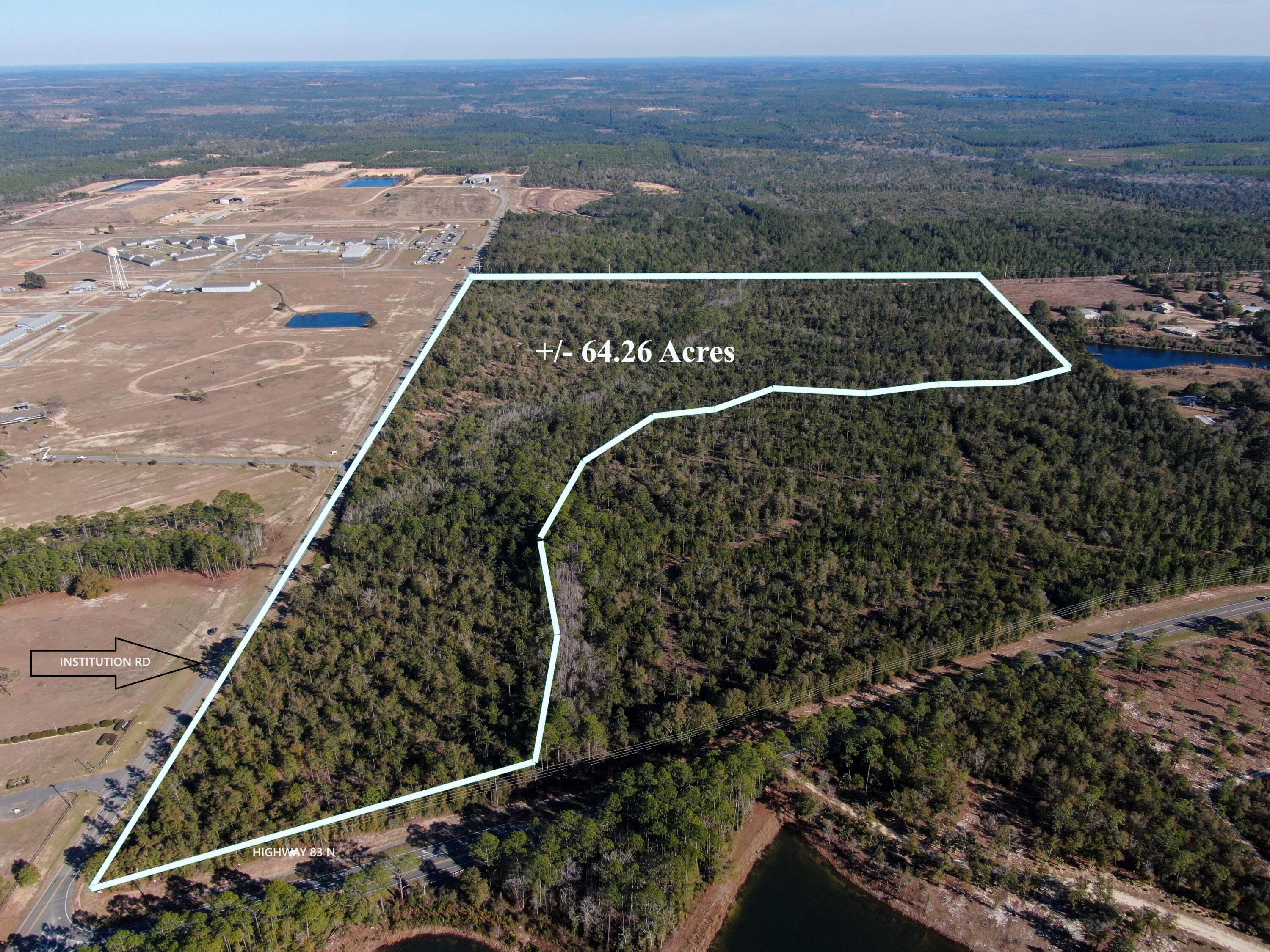 64 ACRES. Zoned Urban Residential. The maximum residential density for this district is four units per one acre. All utilities are available. Subject property is located approximately 4 miles north of downtown historic DeFuniak Springs. Subject property has 550 feet of Hwy 83 road frontage and 2084 feet of road frontage on Institution Road. Hard to find 64 acres that is zoned urban residential at this price.