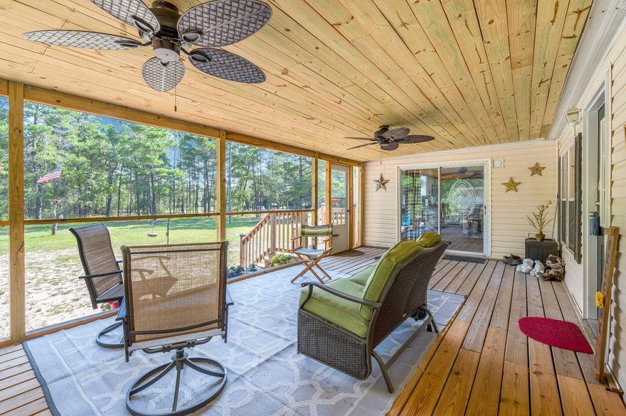 This country get-away is ready for you to call it home!!! 5 Bedroom 3 Bath home on 9.34 acres is located centrally providing easy commute to the local bases, beaches, and shopping centers. HVAC - 2018.  Metal Roof-2022. Massive screened in porch perfect for watching the wildlife as you enjoy your morning coffee. Step in and you will be greeted with a spacious floor plan ready to entertain family and friends. Newly remodeled kitchen with custom Amish soft close cabinets, stainless steel appliances, and granite countertops along with over AND under cabinet mood lighting for that extra touch. Focal point electric fireplace perfect for ambient lighting as well as a great heat source during family movie and game nights during the winter season!  The shop is every tinkering soul's dream with