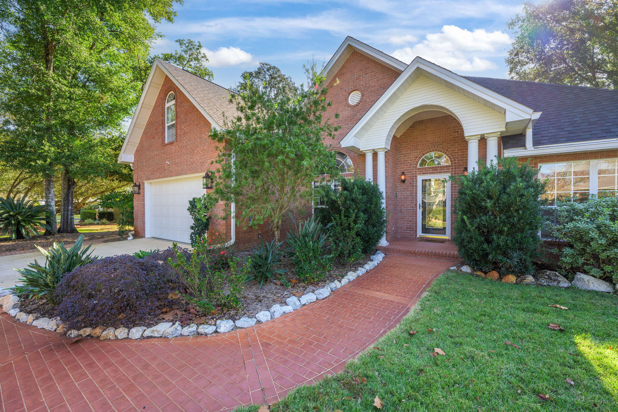 *2 Landfall boat slips currently for sale (#2 and #54)!* Situated on a no-outlet street in the established waterfront community of Landfall, this impressive property is packed with upgrades and luxurious features! Enjoy a new roof (2022), tankless gas water heater, whole-house generator, and privacy fence surrounding the backyard. The massive kitchen is a chef's dream with French pattern travertine flooring, a 5-burner gas cooktop,  Bosh ultra-quiet dishwasher, wall oven and convection oven with warming drawer, Mother-Of-Pearl backsplash, stone countertops, and under/over cabinet lighting, all creating a perfect coastal aesthetic. Two dining areas include a formal dining space for 12 and a casual eat-in breakfast area. The spacious primary suite boasts a completely renovated bathroom with dual and rain shower heads, body jets, music control, and mood lighting for a spa-like experience. The adjoining climate-controlled sunroom opens to the new hot tub. Additional outdoor living spaces include a screen-enclosed patio and a lush Georgia hybrid grass backyard. This home offers four bedrooms, including three on the first floor and a large upstairs bedroom with an en-suite bathroom featuring new stone countertops and a walk-in shower, making for the perfect bonus room space. Practicality meets convenience with a large laundry room equipped with extra storage and a utility sink just off the two car garage. You'll love the access to the gated marina with boat slips available for purchase. Located just 1 mile from NAS back gate, 8 miles to Perdido Key Beach, and 3 miles to Big Lagoon State Park, this home blends elegance, comfort, and ideal proximity to coastal living.