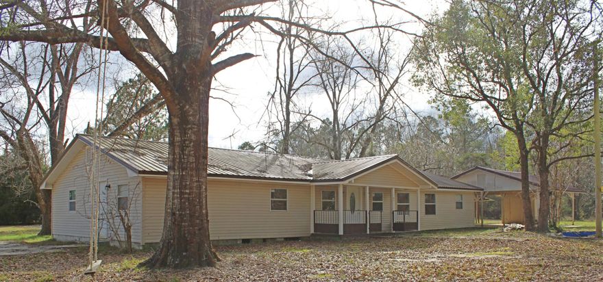 If you are looking for privacy & seclusion, then you have found your paradise!!! Renovated home with over 2200 sq ft includes FIVE bedrooms and two bathrooms on a corner lot that is over an acre. Renovations include some of the windows being replaced and new blinds, new appliances (refrigerator, dishwasher & stove), fresh paint throughout, updated well and installed new water filter, new light fixtures, new septic tank and drain field. Property includes a two car carport and 28x16 shop with electricity and plumbing!!! Come view this home today!!!