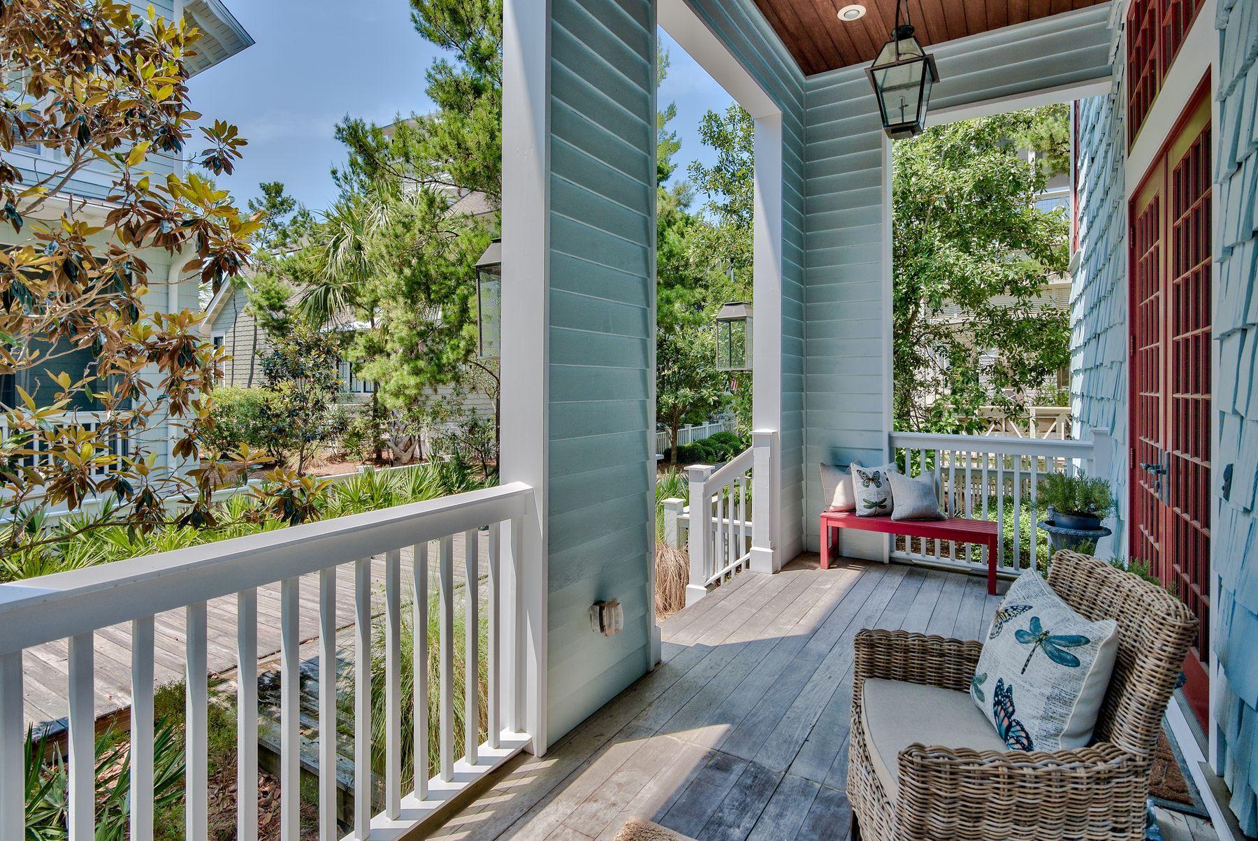 Located in the exclusive gated community of Water Sound Beach, this five-bedroom home sits on a well-positioned corner lot. The shingle-clad property shares the lot with a detached garage and private courtyard with pool. The moment you step inside this 3,546 square-foot property you'll appreciate the space. Take note of the gorgeous walnut flooring and the newly refreshed dcor by Laura McKee of Dwell Interiors. The custom finish is enhanced by airy 13-foot cathedral ceilings with crown molding and exposed rafters on the first floor. This level also includes a master suite. The open plan great room is enhanced by custom built-in bookcases and full-height windows that flood the room with natural light.