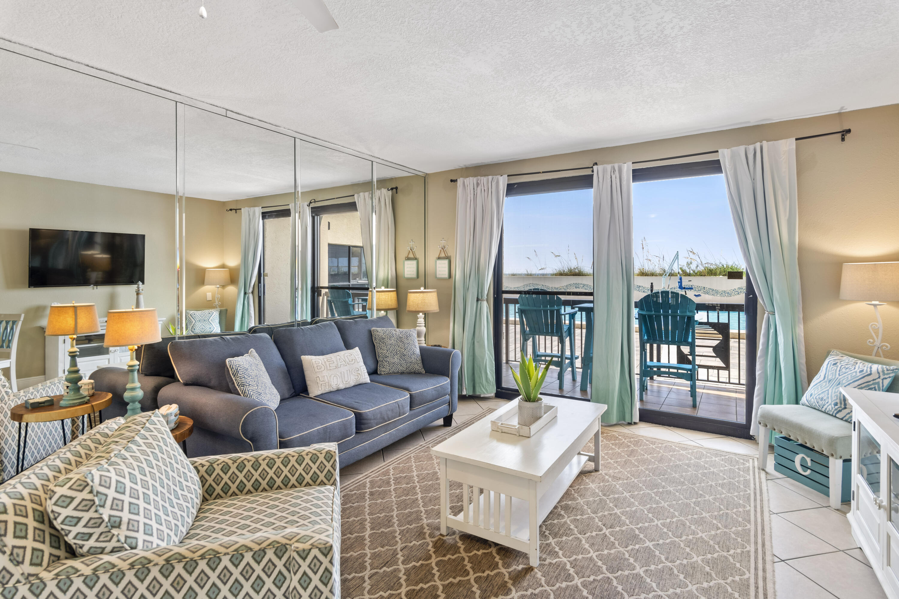 Incredible value at SunDestin for this direct Gulf front unit. This 1-bedroom, 1.5 bath ground floor condo has easy access to the pool and beach right from the patio! be awed by this ideal vacation getaway. Before you're swept away by the breathtaking views, you'll come upon a master bedroom with an ensuite bathroom, connecting to shared half bath. You'll notice the added bonus of 1 foot higher ceilings in this unit being that it is an end unit as you come into the open floorplan. The kitchen features granite countertops, new appliances, and a bonus breakfast bar in addition to the dining area. Some other recent upgrades include new mattresses, sofa bed, side tables, and outdoor furniture.