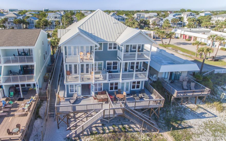 GOOD DAY SUNSHINE!! It won't take you long to find a room with a view OR to fall in love while standing inside of this gorgeous GULF FRONT town home on Crystal Beach. Sugar white beach, emerald green water, your very own private beach with service and unobstructed views for miles, this is the perfect second home get-away and a great investment property opportunity. 5 bedrooms and 5 bathrooms, this home sleeps 20 and is a money maker! Beautifully furnished with chic coastal dcor, you'll find a gulf front bedroom, kitchenette and sitting area on the first floor. Additional bedroom and full bath on this floor. Make your way upstairs for spacious living, open kitchen, more incredible views along with more large bedrooms and bathrooms! Take in every sunrise and sunset from one of 5 balconies!