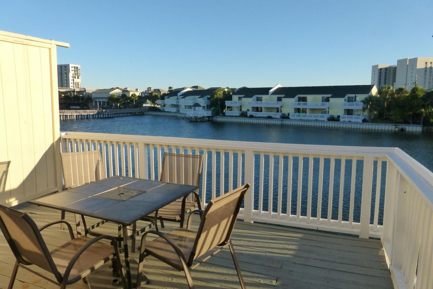 Lovely Townhome with a fabulous view of the lake. Two outdoor decks. Completely furnished turn key. Buyer to verify all dimensions.