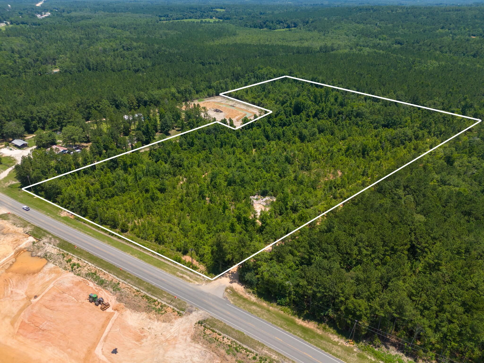 This 22 acre corner parcel is located in Washington County just south of Wausau. The front 6 (+-) acres is zoned (FLU) General Commercial and has approx 640' of frontage along Hwy 77 and 415' along Ben Road. The middle 16 (+-) acres is zoned AG. Currently, SR-77 is being widened to 4 lanes with plans of estimated completion in 2027. See the FDOT website for Northwest Florida Roads for additional information on the SR 77 Widening Project in Wausau. A survey is available. If measurements deemed important, please verify.