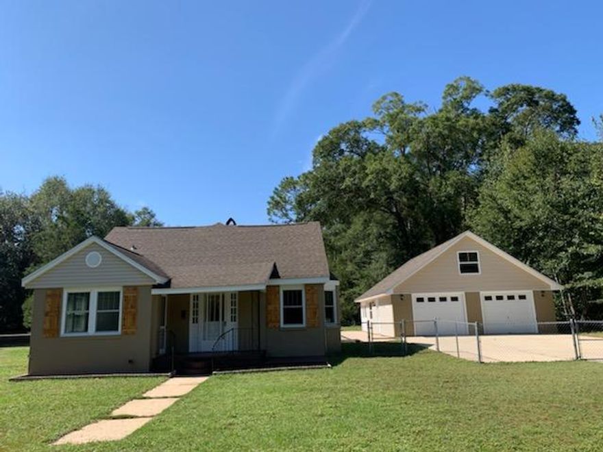 This House has so many great features and charm located on a Beautiful Lot. The Main House is Two Story with the Master on the Second Floor featuring Hardwood floor and Tile in the Bath. Two Bedrooms Downstairs with newer Carpet. There is an additional Room Downstairs tiled, which may be used as a 4th Bedroom, Sitting Area or Study. You will find a Spiral Staircase that leads to the Master Suite and Bathroom with a Stain-Glass Window. From the Master Suite step out onto the Large Deck overlooking the Gunite Pool. This Home was definitely designed for Outdoor Living & Entertaining featuring a Open & Covered Patio, Fire pit, Waterfall & Large Fenced Yard for Outdoor Games. Oversized Garage with 600 sq. ft. Attic on Second Floor, there are 2 Electric Door Openers & 1 Bay Roll Up Door.