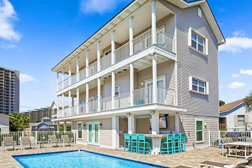 169 Norwood Dr.: A Turn-Key Coastal Retreat with Gulf Views, Pool, and Steps From the Beach.Welcome to 169 Norwood Dr., a stunning three-story vacation home in the heart of Miramar Beach, Florida. Recently renovated and expanded, this property features 5 bedrooms, 5 bathrooms, and comfortably accommodates up to 20 guests. Situated just steps from the Gulf of Mexico with no roads to cross, this fully furnished and professionally decorated home is a true turn-key investment opportunity. Enjoy breathtaking Gulf views from multiple balconies and a host of luxurious amenities.The private outdoor area boasts a 12' x 24' swimming pool surrounded by lush tropical landscaping and swaying palms. The poolside bar is fully equipped with a beverage center, ice maker, sink, TV, and stereo, offering the perfect setup for entertaining or relaxing after a day at the beach. Wraparound balconies on the second and third floors provide stunning Gulf views, where you can enjoy the coastal breeze and serene surroundings.

The first floor includes a bonus den with a queen sleeper sofa and patio access, a king bedroom with an en suite bath featuring a walk-in shower, a bunk room with two twin bunk beds, and a hall bath with a walk-in shower.

The second floor features an open living room with a queen sleeper sofa and balcony access. The fully equipped kitchen includes stainless steel appliances and flows seamlessly into the dining area with seating for eight and additional bar seating for four. A bunk room with a full/twin bunk bed and twin trundle offers additional sleeping space and has access to a shared hall bath with a tub/shower combo. This level also includes a laundry room.

The third floor is home to a king master suite with an en suite bath, a tub/shower combo, and private balcony access with Gulf views. Another king bedroom features a queen sleeper sofa, an en suite bath with a tub/shower combo, and its own private balcony with Gulf views.

Located in a quiet residential neighborhood, 169 Norwood Dr. offers privacy while being conveniently close to Miramar Beach's best attractions. The property is just steps from the beach, with no roads to cross, and is minutes away from restaurants, beach bars, and coffee shops. Enjoy shopping at Silver Sands Premium Outlets, and fine dining and seasonal events at Grand Boulevard and Baytowne Wharf.

With rental projections exceeding $185,000 annually, 169 Norwood Dr. is a rare opportunity to own a high-performing vacation rental property. Its thoughtful design, luxury amenities, proximity to the beach, and Gulf views make it a standout option for families and investors alike.

Don't miss your chance to own this one-of-a-kind coastal retreat. Whether you're seeking a private getaway or a profitable addition to your investment portfolio, 169 Norwood Dr. offers it all.