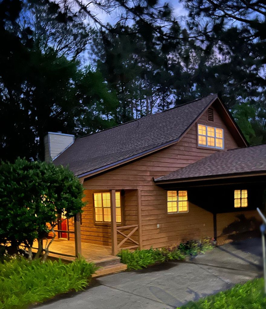 Perfectly situated on a quiet street, this home is approximately 3 miles from the public beach access and 3 miles to the Bay's boat ramp. This home sits on a large lot featuring a walkway bridge over the creek that accentuates the charm of its private outdoor space.The open concept kitchen boosts functionality with ample prep space and eat-in dining area, completed with granite countertops.The living room features cathedral ceilings with exposed wood beams and a fireplace with marble hearth.The updated back deck and the large front porch create the ideal space for welcoming friends and enjoying the outdoors.