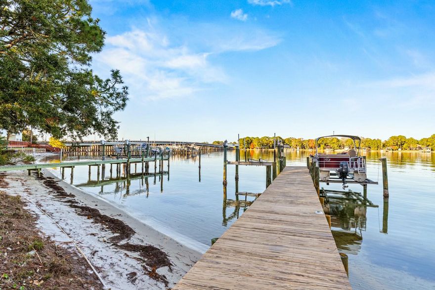 Updated price on this wonderful waterfront townhome that is available directly on Cinco Bayou! Check out this wonderful three bedroom, three bathroom unit available on Yacht Club Drive in Fort Walton Beach, Florida. Enjoy being able to fish, paddle board, kayak and more right out your back door! This unit boasts over 2000 square feet and comes deeded with a shared dock with Unit 1 and a boat slip. You will be just a short walk from shopping, parks, the Fort Walton Beach Yacht Club, and can look for dolphins daily from your oversized porch. The Roof was replaced in 2018, water heater 2020, HVAC in 2014, and a transferrable flood policy is available. Unit does need some work, ask your favorite agent for details and schedule your own private showing today!
