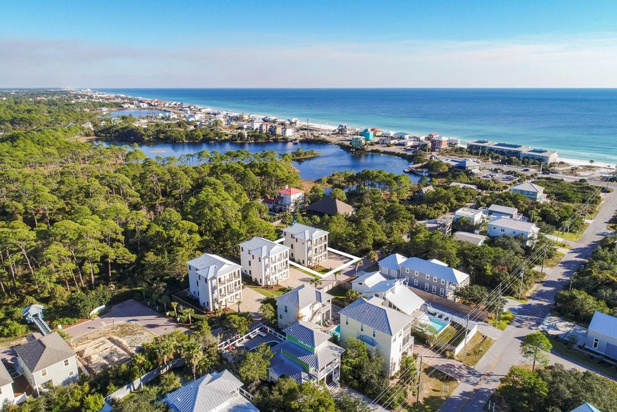 Exemplary coastal construction prominently located on the West end of 30A offering exceptional proximity to beach access as well as luxurious interior & exterior appointments. Professionally furnished by Coastline Interiors, this turn-key contemporary new-build features six bedroom suites with impressive rental projections exceeding $130,000 in gross annual revenue. Notable amenities include an oversized lot with ample parking, private gated pool area well-designed with a sun deck and wrap around putting green. Interior features include a private elevator with access to each of the oversized bedroom suites. The open floor plan offers an oversized living room, dining area and ‭chef's kitchen appointed with custom cabinetry, quartz countertops & stainless appliances including a natural