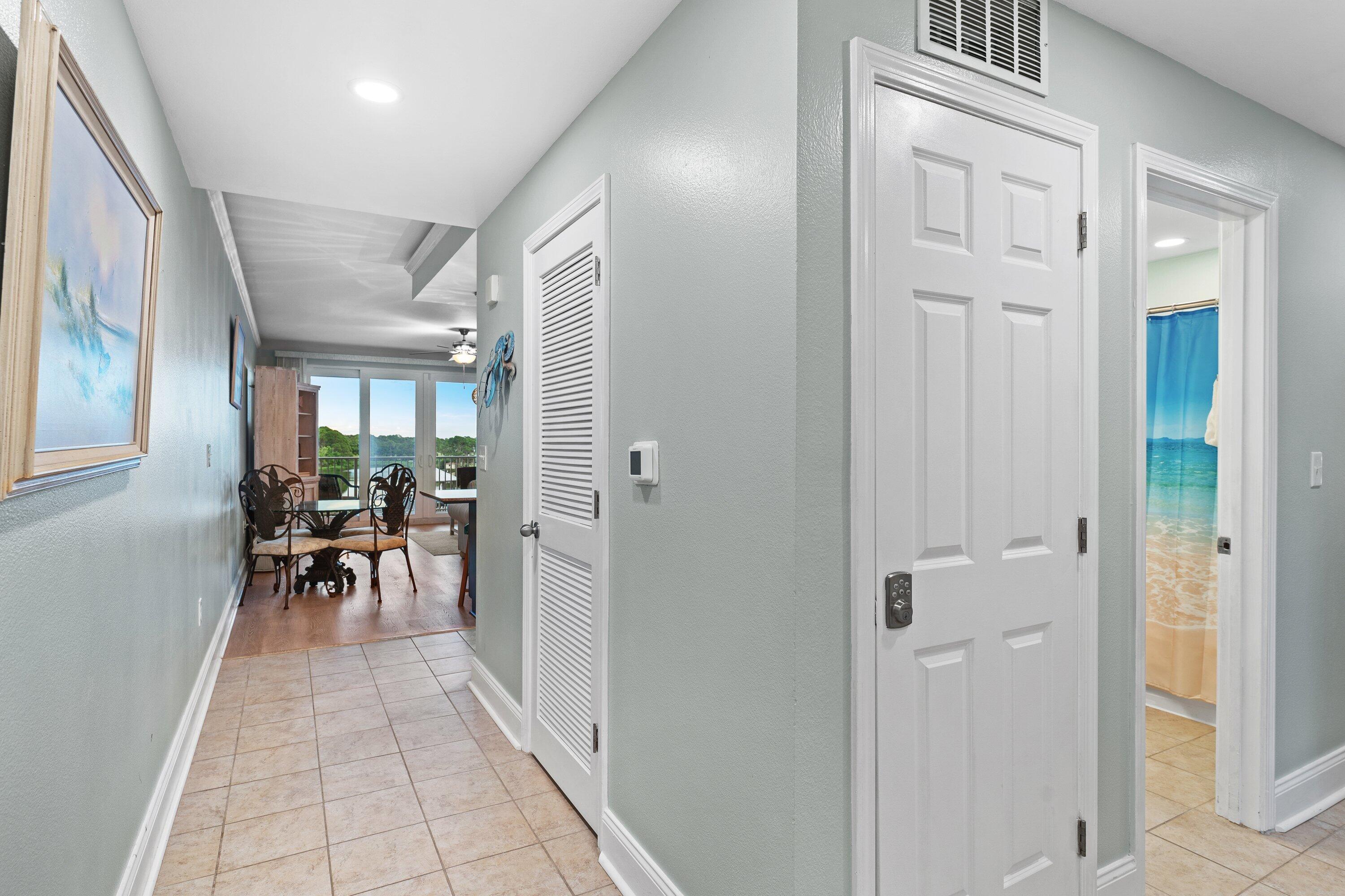 Amazing deal alert... recently updated and ready for you! This perfect turnkey, rental-ready lakeview condo at Laketown Wharf offers 2 bedrooms, 2 bathrooms, plus a bunk room with approximately 1,262 sqft. Enjoy a spacious open living and dining area featuring granite countertops and a fully equipped kitchen with a breakfast bar. Recent upgrades include a newer HVAC system (2023), newer water heater (2022), fresh paint throughout, painted cabinets in the kitchen and master bathroom, tiled kitchen backsplash, new light fixtures, LED lighting throughout, crown molding in the living room and bedrooms, and a barn door on the bunk room for added privacy. Step out onto the spacious balcony to take in stunning lake views and fountain displays. Laketown Wharf offers exceptional resort amenities with 5 swimming pools, a putting green, and so much more!