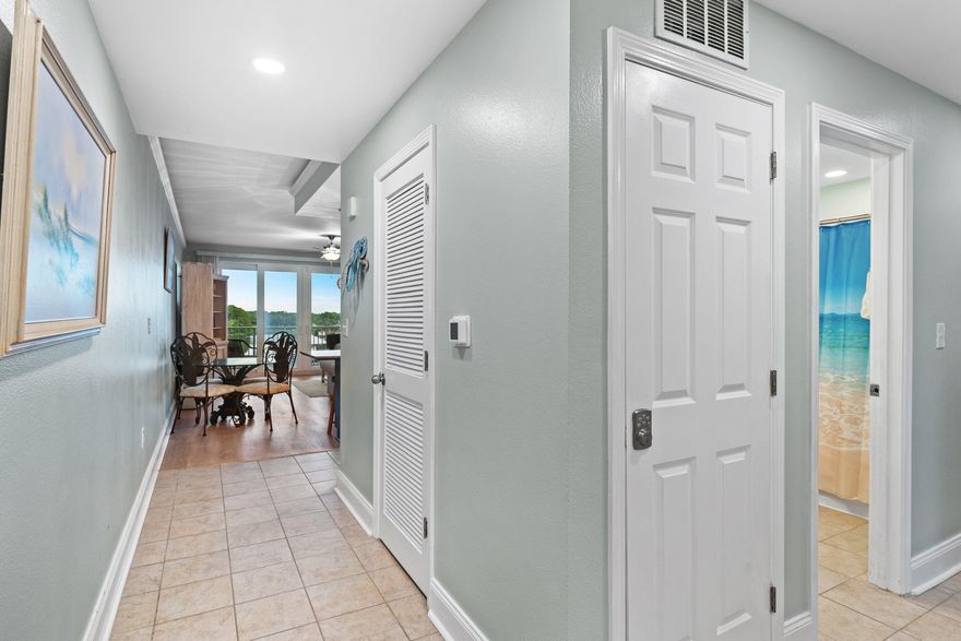 Amazing deal alert... recently updated and ready for you! This perfect turnkey, rental-ready lakeview condo at Laketown Wharf offers 2 bedrooms, 2 bathrooms, plus a bunk room with approximately 1,262 sqft. Enjoy a spacious open living and dining area featuring granite countertops and a fully equipped kitchen with a breakfast bar. Recent upgrades include a newer HVAC system (2023), newer water heater (2022), fresh paint throughout, painted cabinets in the kitchen and master bathroom, tiled kitchen backsplash, new light fixtures, LED lighting throughout, crown molding in the living room and bedrooms, and a barn door on the bunk room for added privacy. Step out onto the spacious balcony to take in stunning lake views and fountain displays. Laketown Wharf offers exceptional resort amenities with 5 swimming pools, a putting green, and so much more!