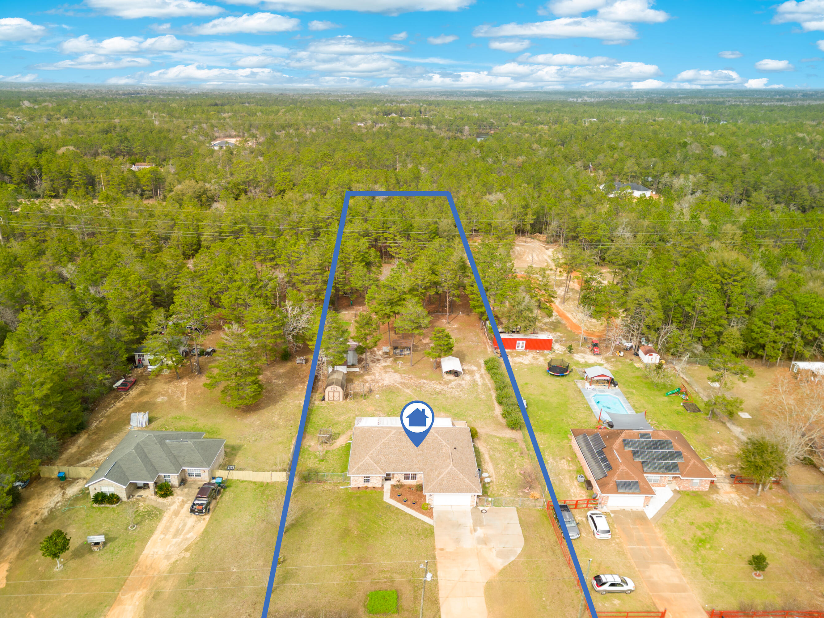 BRICK HOME ON 1.67 ACRES WITH 2 WORKSHOPS.. SMALL PASTURE.. PRIVATE CAMP AREA.. BLUEBERRY PATCH.. GRAPE VINEYARD.. CUSTOM PLAYHOUSE.. FIREPIT.. AND OUTDOOR KITCHEN!!!STOP RIGHT NOW AND CHECK OUT THE PHOTO SLIDE!This 4 BR/2 bath home checks all of the boxes: hand scraped flooring.. neutral paint.. tall ceilings.. updated lighting.. split floorplan.. spacious bedrooms.. newer roof (2016).. newer HVAC (2016).. yet still offers UNTAPPED EQUITY! Yep! Upgrade the countertops and cash in!The real appeal of this home, however, is what's outside. There's an OUTDOOR KITCHEN/GRILLING AREA.. an expansive screened porch.. 2 FULLY POWERED WORKSHOPS (metal and wood).. multiple gardening areas, SMALL PASTURE/CROSS FENCING.. IRRIGATION SYSTEM.. and your own PRIVATE WOODED CAMPGROUND.