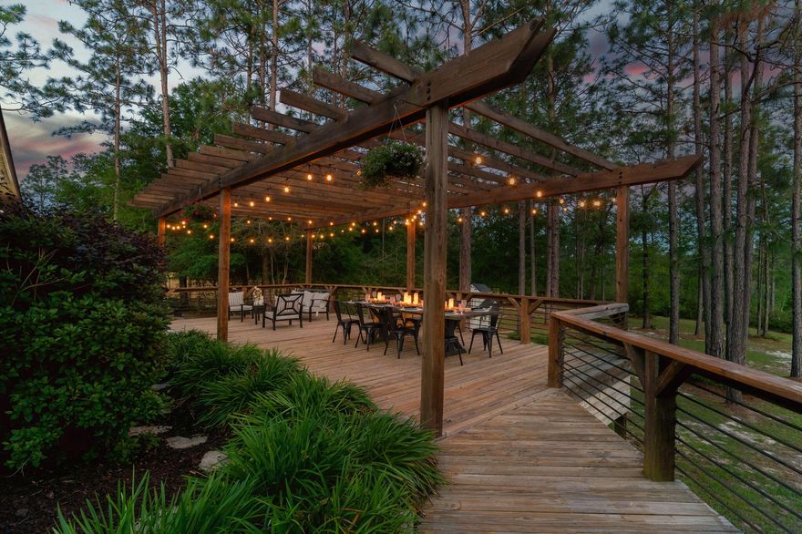 Welcome to 6511 Welannee Blvd, situated in the desired community of Yellow River Plantation! YRP is known for commanding homes, 1 acre lots (all lined w/white picket fencing @ the road), & landscape buffers between all properties. This home provides an enchanting outdoor entertaining area,sure to make your home *the spot* for future family celebrations & milestones. The dreamy deck area is lined w/tasteful landscaping and a paver patio, covered by a pergola w/string lighting for a truly enjoyable outdoor experience. Inside, you will find modern color choices and accents. This home is carpet free,which makes for easy maintenance. All 4 bedrooms are generous in size & closet space, w/3 car garage offering additional storage space. **VA Assumable Loan @ 1.75% Ask your buyer rep for details!