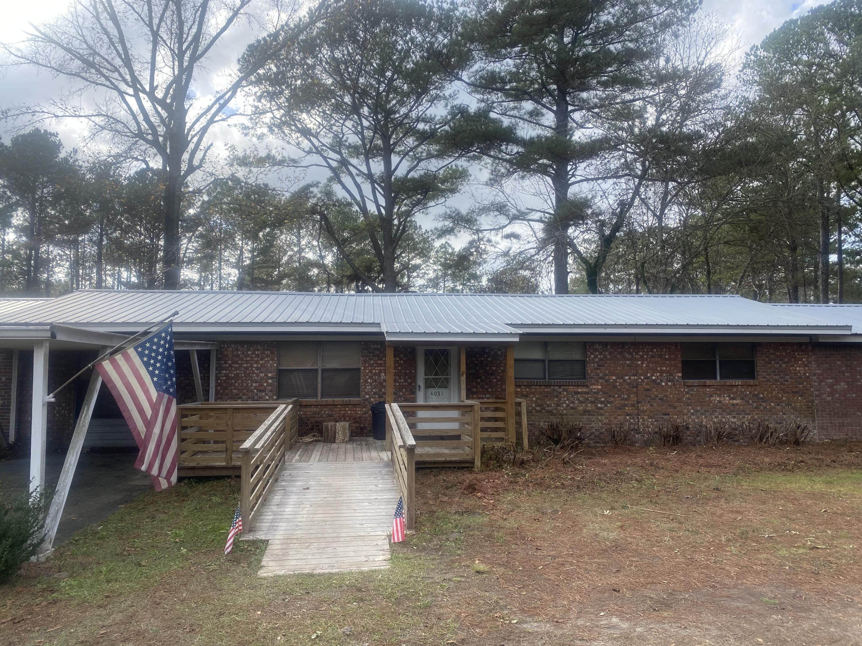 More pictures coming soon! Calling all Investors. Cash Only! An opportunity to own two homes! The main home is 2625 sq. ft. with an additional 1,000 sq. ft. in porches and ramps. 4 bedrooms, 2 1/2 bath. The bedrooms on each end of the home are 22x23! The Master Bath is set up for handicap usage. The home will need some TLC to bring it back to it's former glory.The second home on the property, built in 2007, is 2 BR 1.5 BA, 1152 sq. ft. It is perfect for a Mother-In-Law home or for a rental. It is occupied now by a renter. Both homes are heated and cooled by window units.