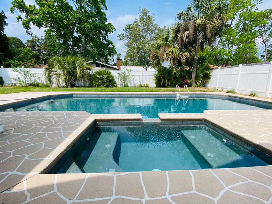 What a relaxing place to reside! Now you can have your own pool home with an easy maintenance backyard surrounded by a white vinyl fence. There is a 200 sf additional sunroom with windows that slide open. Your pool is deep teal in color and the hot tub flows over the edge to the pool. It can be heated but feels comfortable as is. There is soft close cabinetry throughout that was upgraded and quartz counters with an added backsplash. The appliances are stainless steel and the sink is one large deep soaker. There is gas for the home so you can enjoy the ambiance of a fire in your family room that has the bonus vaulted ceiling feature of knotty pine details. The windows were covered with luxury plantation shutters. If you would like a fresh coat of paint in the home, that is an option!!