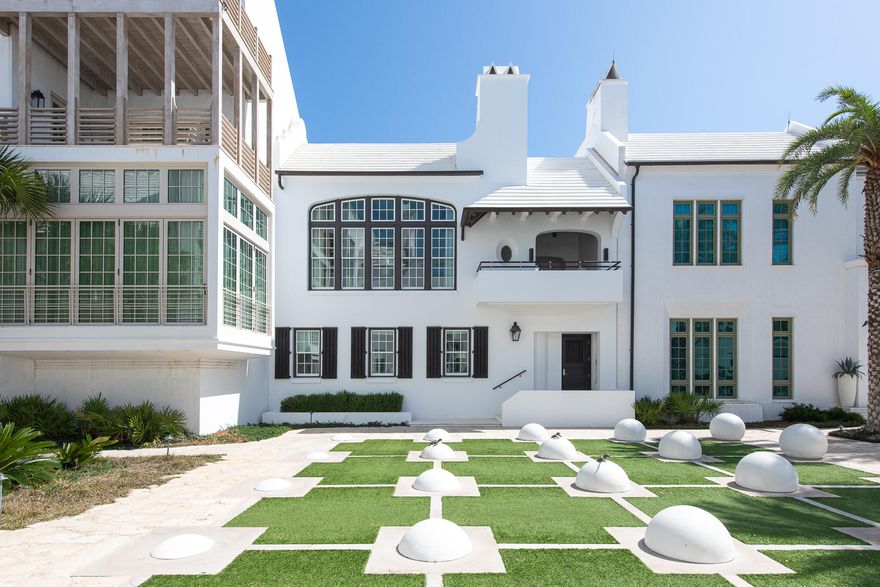 Discover the unparalleled luxury of 32 Kings Castle Court in Alys Beach, a remarkable home designed by renowned architect Gary Justiss. Nestled south of Scenic Highway 30A, this custom residence is perfectly positioned along the iconic Turtle Bale Pedestrian Path, leading directly to the pristine Gulf of Mexico. Gary Justiss's exceptional talent shines through in this four-bedroom home, which harmoniously integrates livability with interconnected private outdoor spaces.  This home epitomizes the Bermudan architecture that Alys Beach is awarded for.The main living level is an entertainer's dream, boasting three distinct outdoor amenities. Enjoy a refreshing swim in the inviting pool with a sunning deck, dine alfresco in the screened patio featuring a summer kitchen, and unwind on the second-floor balcony loggia overlooking the Turtle Bale Pedestrian Path. This loggia, furnished for relaxation, offers stunning views of western sunsets and is appointed with an outdoor fireplace and TV. The seamless combination of French doors and bifold door systems invites the outdoors in, creating a cohesive living experience. The expansive kitchen, dining, and living areas are designed as one space, adorned with beautiful custom windows that capture abundant natural light while showcasing views of the acclaimed pedestrian path.

The primary suite serves as a personal oasis, outfitted with custom window treatments and designer tile work. The luxurious bathroom features a soaking tub nestled within a grotto, while a generously sized closet with custom cabinetry connects to a family office and workout room, all contained within the primary suite's envelope. Each of the three guest bedrooms offers en suite bathrooms, beautiful custom-built cabinetry, and walk-in closets, ensuring comfort and privacy for all guests.

Ownership of this extraordinary home includes access to all Alys Beach amenities, including the exclusive private owners' Beach Club. With its exquisite design and thoughtful features, 32 Kings Castle Court meets the needs of discerning Alys Beach property owners. This property is truly a must-see.