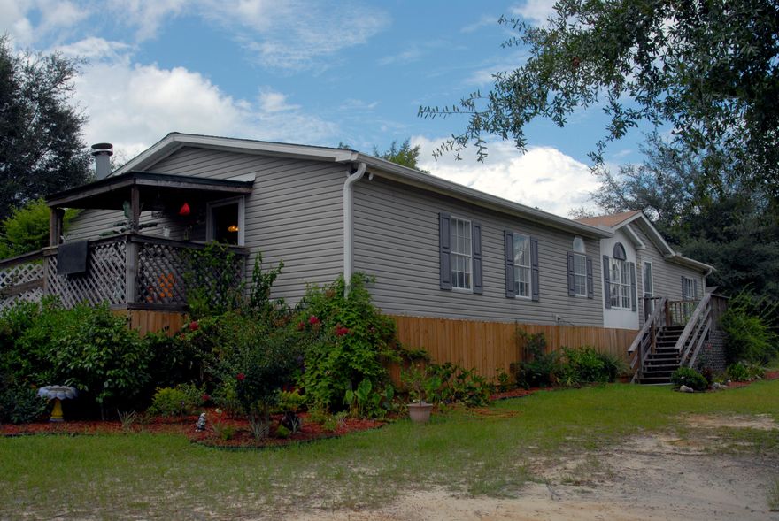 Price Reduction = Motivated Seller! Spacious double wide in great condition with a ideal floor plan and a brand new roof! Situated on a large lot located in Juniper Lake Estates.