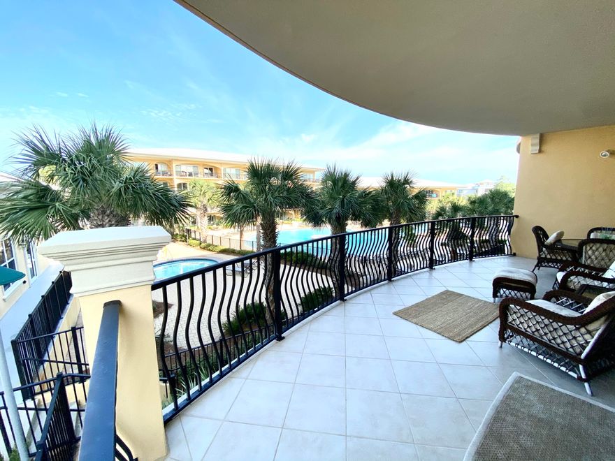 Gorgeous pool view unit at prestigious ADAGIO! End unit with views of the Gulf from the front bedroom and a lot of natural light in the Living Room due to the additional windows. Exceptionally designed and decorated with many high end furnishings. Adagio has a huge community pool, hot tub, exercise room, gated entry, private beach access, a second heated Gulf front pool, and so much more! ***The large Silver fish on the wall in the living room do not remain with the property.