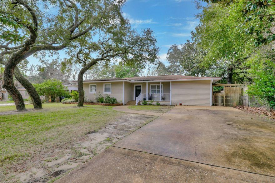 The adorable updated home in sought after Kenwood Estates has a large fenced yard and is close to both bases. This four bedroom two bath home has a stunning kitchen with newer cabinets that have easy close fixtures, Sile stone counters with stainless appliances, that include a new refrigerator , doubl oven with smart wifi. The French doors lead to the backyard where there is a covered deck, privacy fence and outdoor shed. Newer doors and light fixtures throughout the home and a tankless gas hot water heater.. The hall bath has been completely remodeled with a travertine shower, vessel sink, and tile floor. The master bedroom has 10 ft ceilings and wood look tile and an updated bathroom. Walk to Kenwood Elementary. Tastefully decorated and pride in ownership shows with this home!