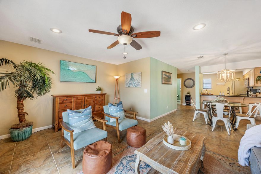 Best-Priced Townhome at Costa Vista - Just Steps from the Gulf! Don't miss this incredible opportunity to own the best-priced townhome in Costa Vista, ideally located in the heart of Miramar Beach just a minute's walk from the sugar-white sands and emerald waters of the Gulf of Mexico. This updated 2-bedroom, 2.5-bath, 2-story townhome offers Gulf views from two private balconies--perfect for al fresco dining, your morning coffee, or a sunset glass of wine. The covered carport offers parking for 2-3 vehicles and includes a large storage room for all your beach gear. Inside, this turn-key residence just received a decorative refresh with a light, coastal palette and is being sold fully furnished for your convenience (some decorative staging items available for purchase). The open-concept main level features a spacious living area that flows seamlessly to the dining space and kitchen. Enjoy granite countertops, stainless steel appliances, a coastal-chic chandelier, breakfast bar for casual dining, full-size washer & dryer, and a convenient half bath. Durable tile flooring spans the main level, while luxury vinyl plank flooring adds style and function upstairsno carpet means easy maintenance for beach life.

Upstairs, you'll find two generous bedrooms. The primary suite features a king bed and its own private balcony with stunning Gulf views and an ensuite bath with a custom tiled tub/shower combo. The guest bedroom comfortably fits a queen and twin bed to maximize rentals and is served by a full guest bath. All rooms are equipped with smart TVs, and there's an owner's closet upstairsperfect for linens or personal items if you choose to rent.

Costa Vista is a low-density community offering a community pool, sundeck, and low HOA fees. Recent updates include a new hot water heater (2025), AC unit (2021), and roof (2007)giving you peace of mind with this solid investment.

Located directly across from the beach and Pompano Joe'sa local favorite for beachfront dining and live musicyou're also close to Camille's at Crystal Beach, Whole Foods, Destin Commons, Silver Sands Outlets, Henderson Beach State Park, and more. A scenic bike and pedestrian path runs the length of Scenic 98, making it easy to explore all the area has to offer.

Unlike a condo, this townhome qualifies for financing with just 10% down, making it an attractive opportunity for a second home or short-term rental. Act nowthis charming beachside townhome won't last long at this value!